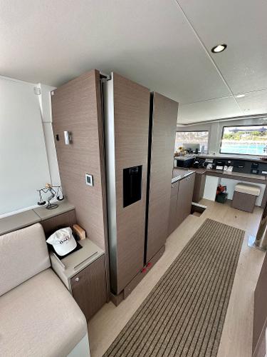 Modern interior of 2021 Bali 4.8 yacht with sleek kitchen and seating area.