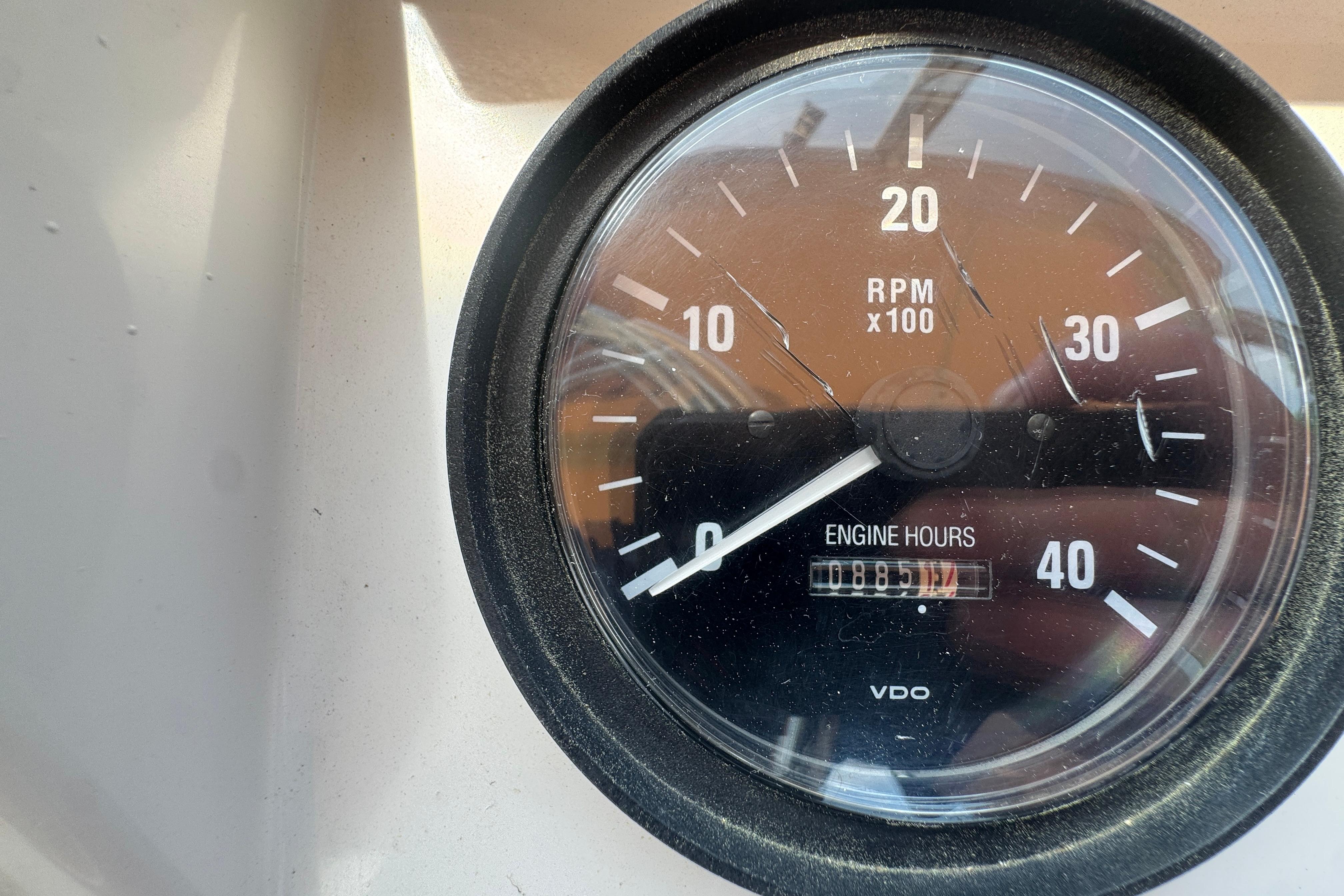 Close-up of a 2002 Mainship 390 Trawler tachometer showing RPM and engine hours.