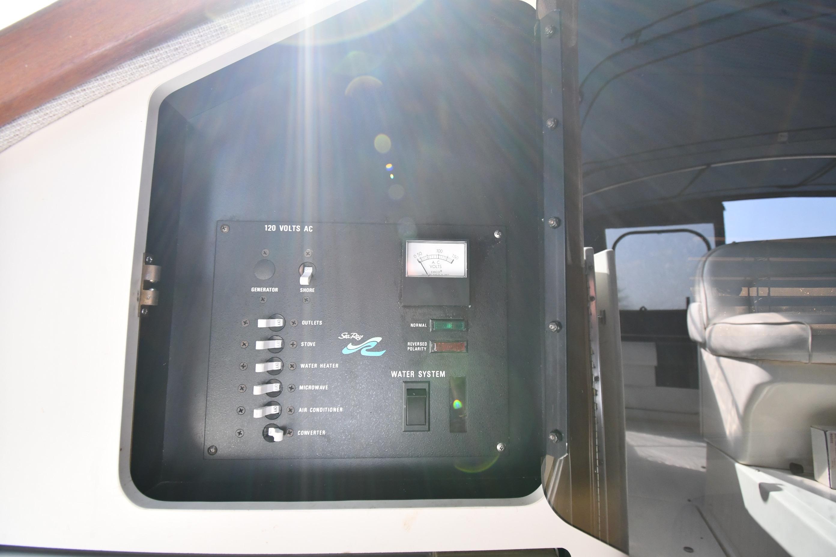 Electrical panel on a 1993 Sea Ray 300 Sundancer boat, showing various controls.