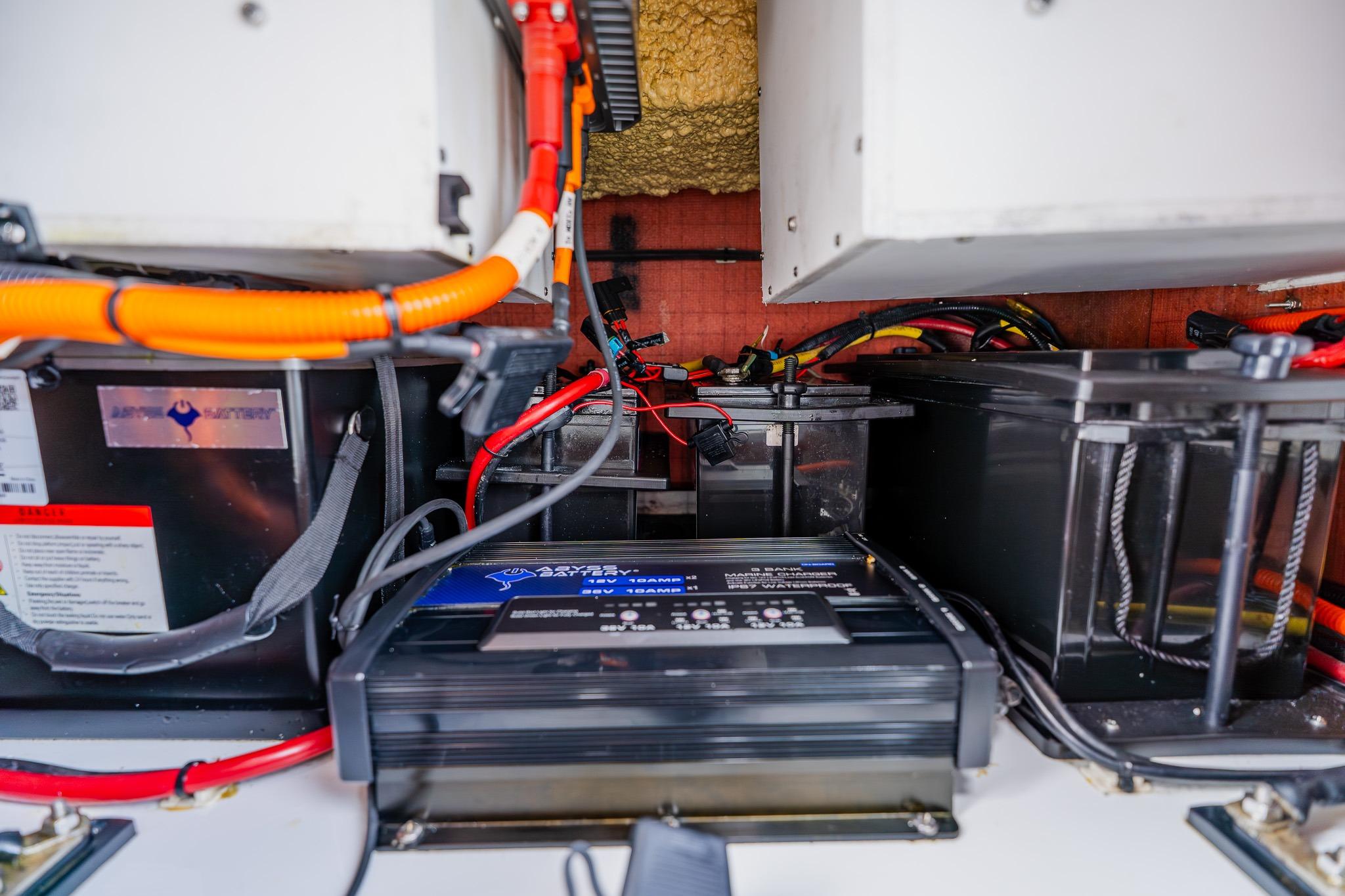 Electrical system setup in a 2023 Freeman 28 boat, featuring batteries and wiring.