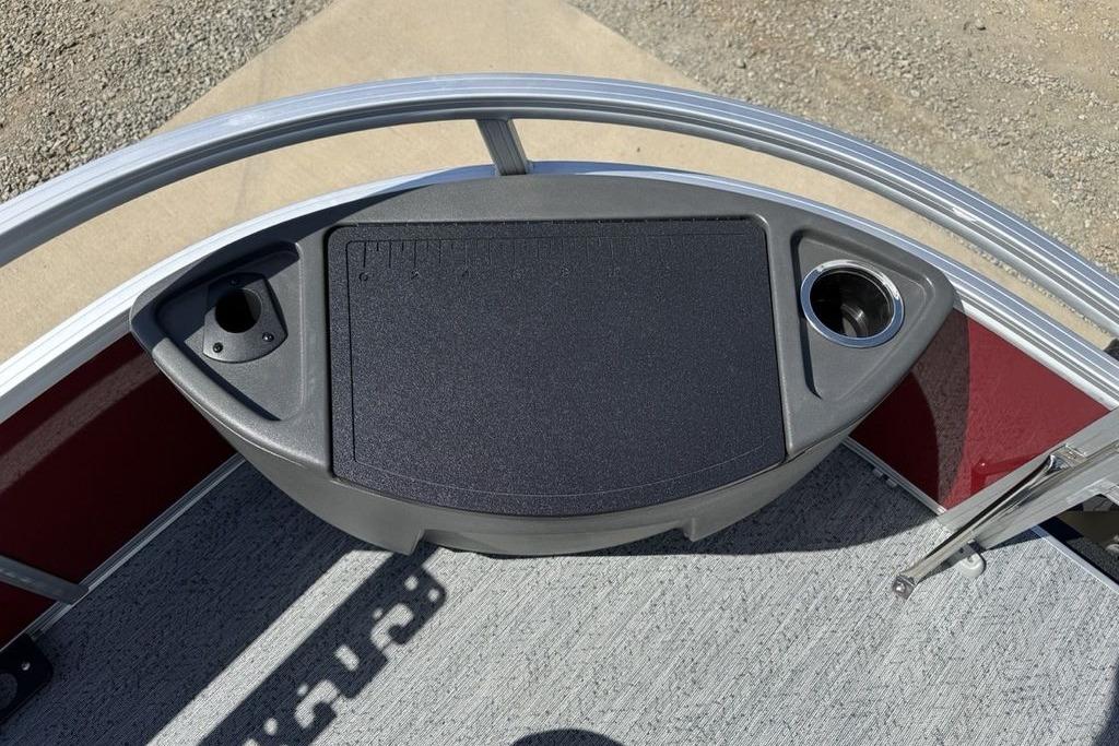 2026 Sun Tracker Bass Buggy 18 DLX boat console with cup holders and storage.