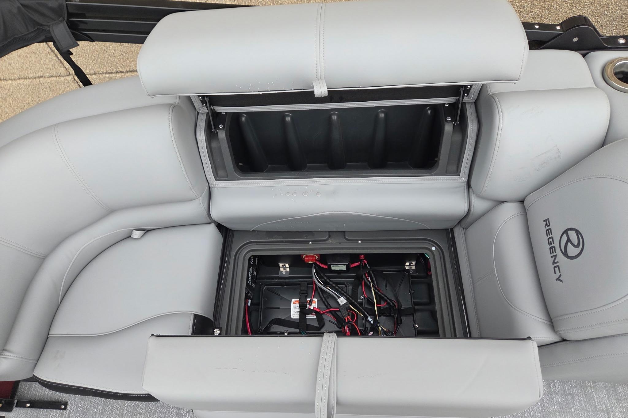 2026 Regency 230 DL boat seat storage with battery compartment and wiring.