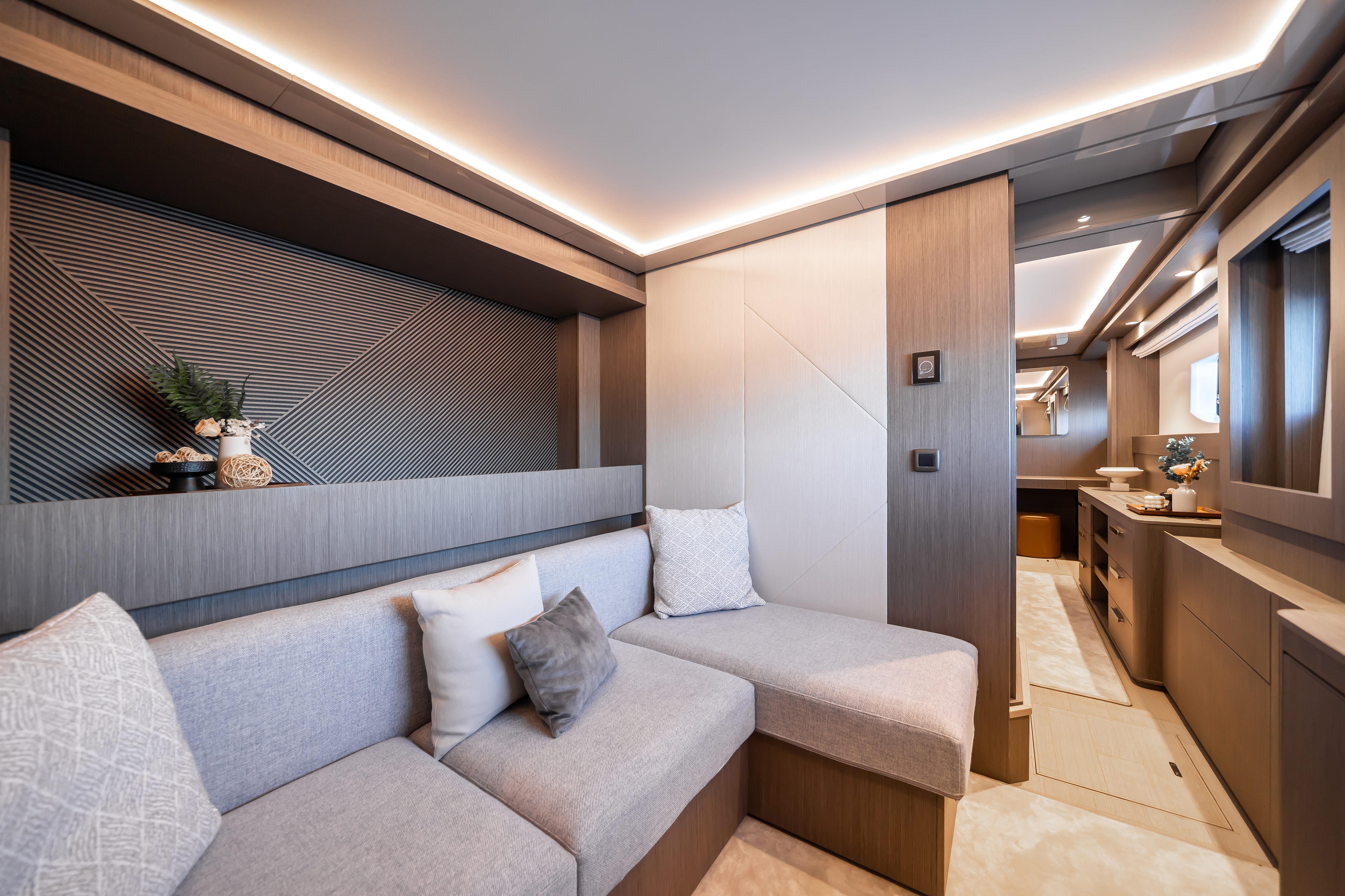 Luxurious interior of 2025 Prestige M8 yacht with modern seating and elegant lighting.