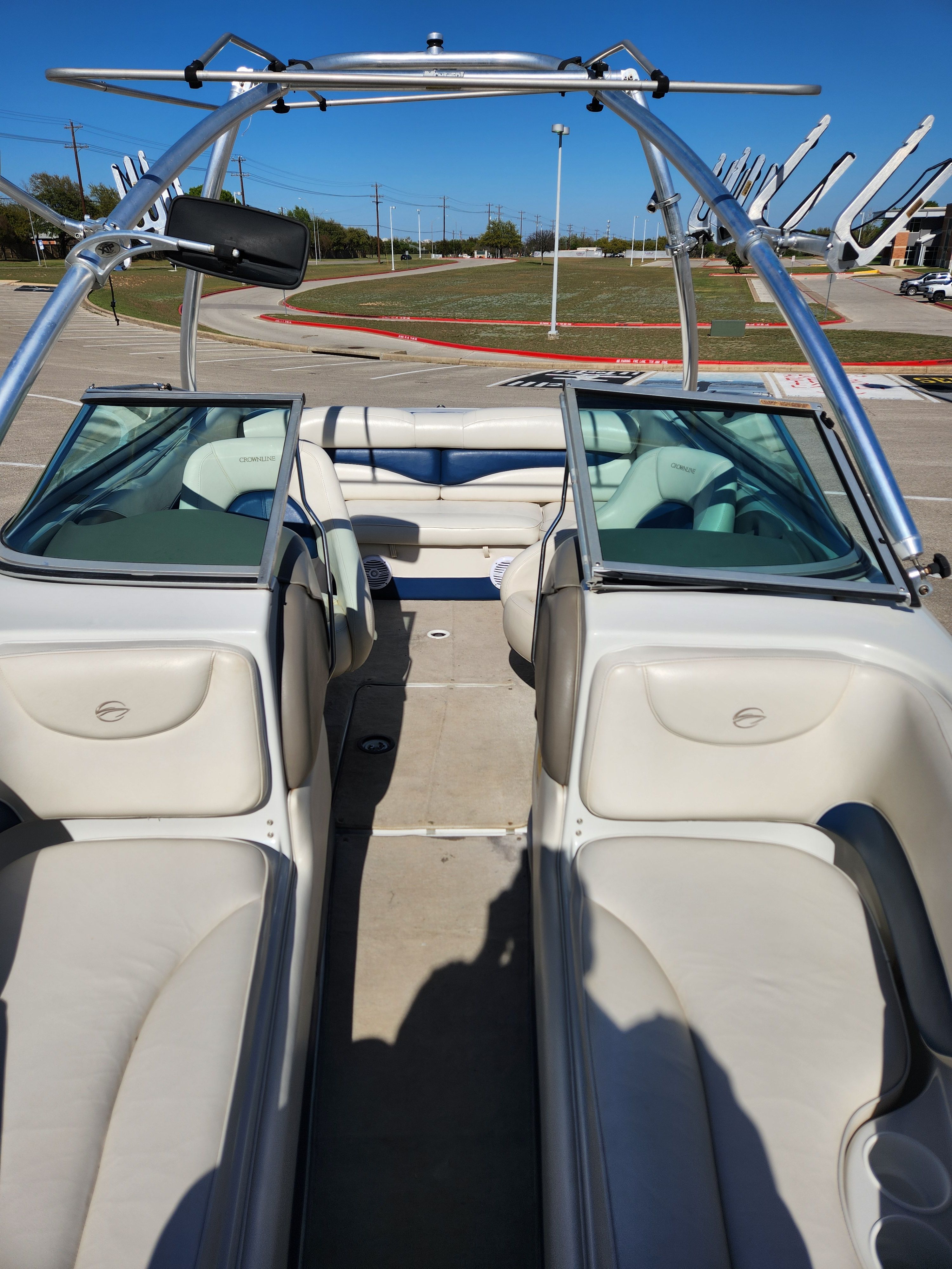 Interior view of a 2003 Crownline 225 BR boat with white seating.