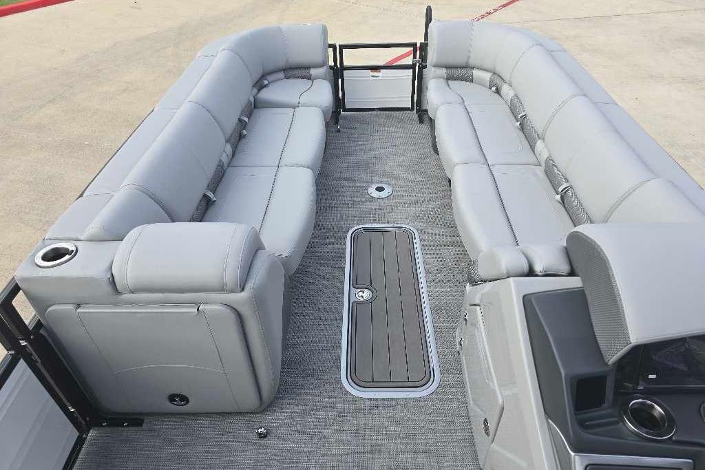 Luxurious seating on 2025 Regency 250 LE3 Sport pontoon boat, featuring sleek gray upholstery.