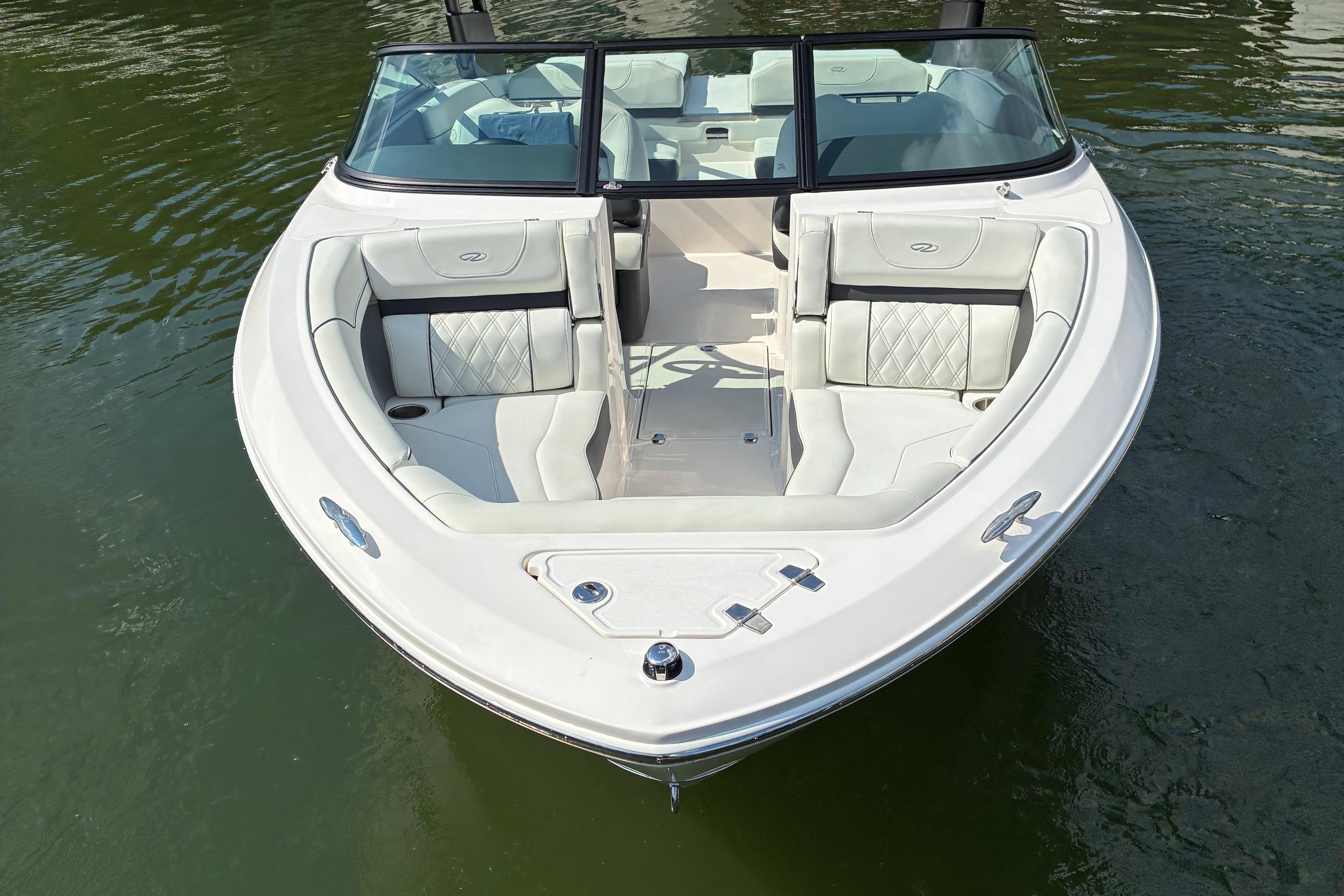 2025 Regal LS2 boat with sleek white interior on calm water.