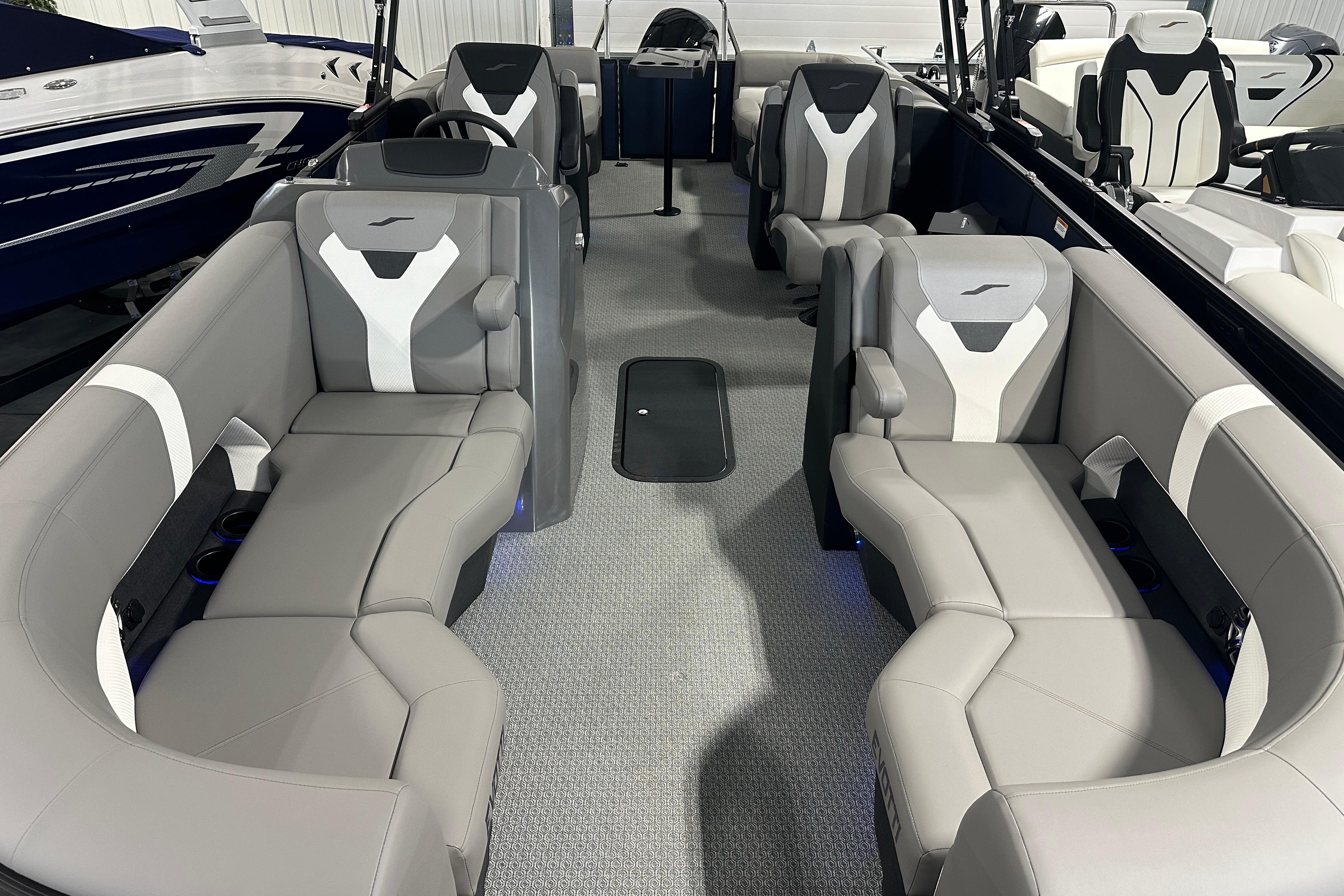 Interior of 2026 Evotti 523QL boat with modern seating and sleek design.