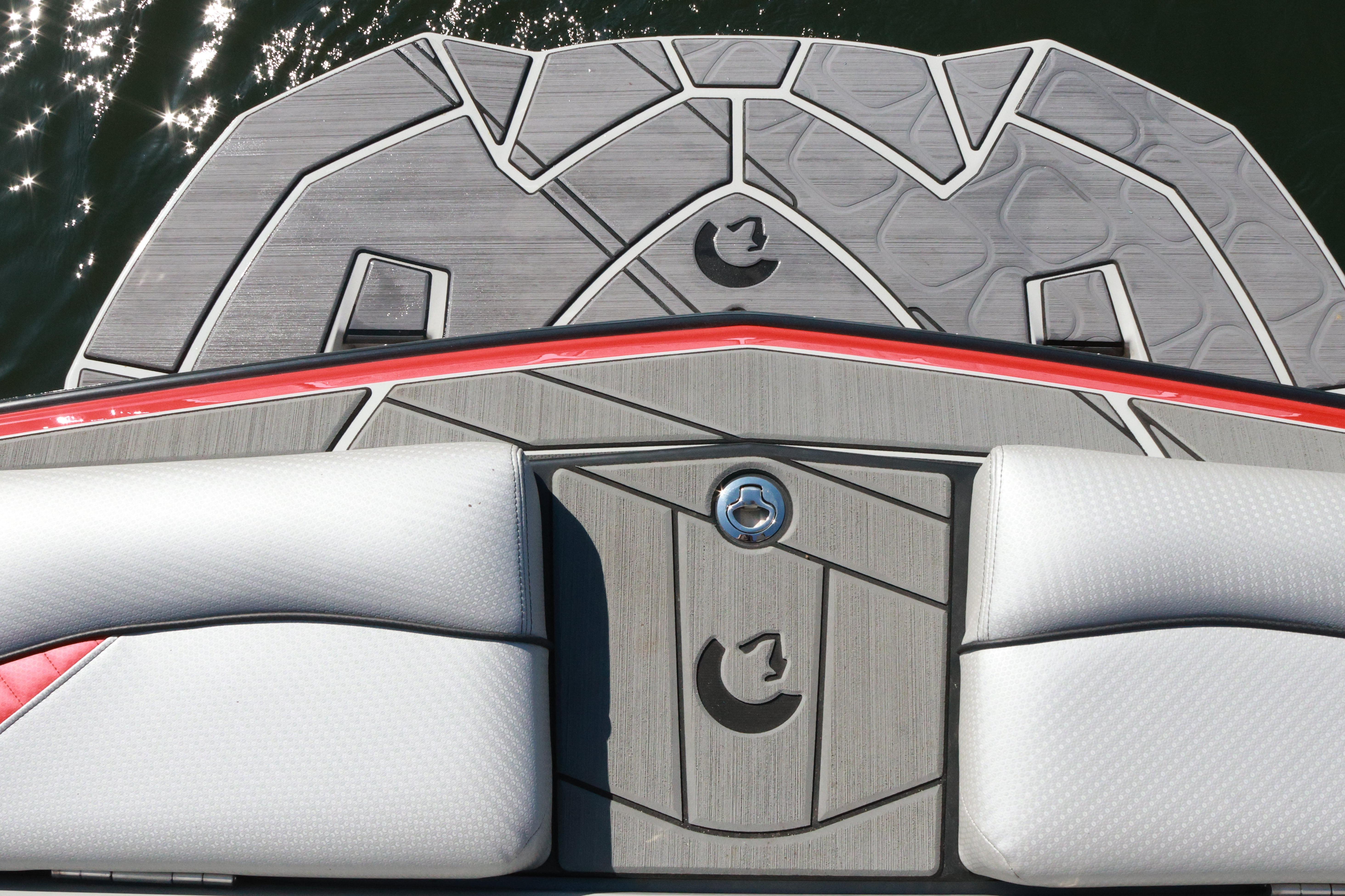 2024 Centurion Fi23 boat deck with stylish gray and red design, featuring cushioned seating.