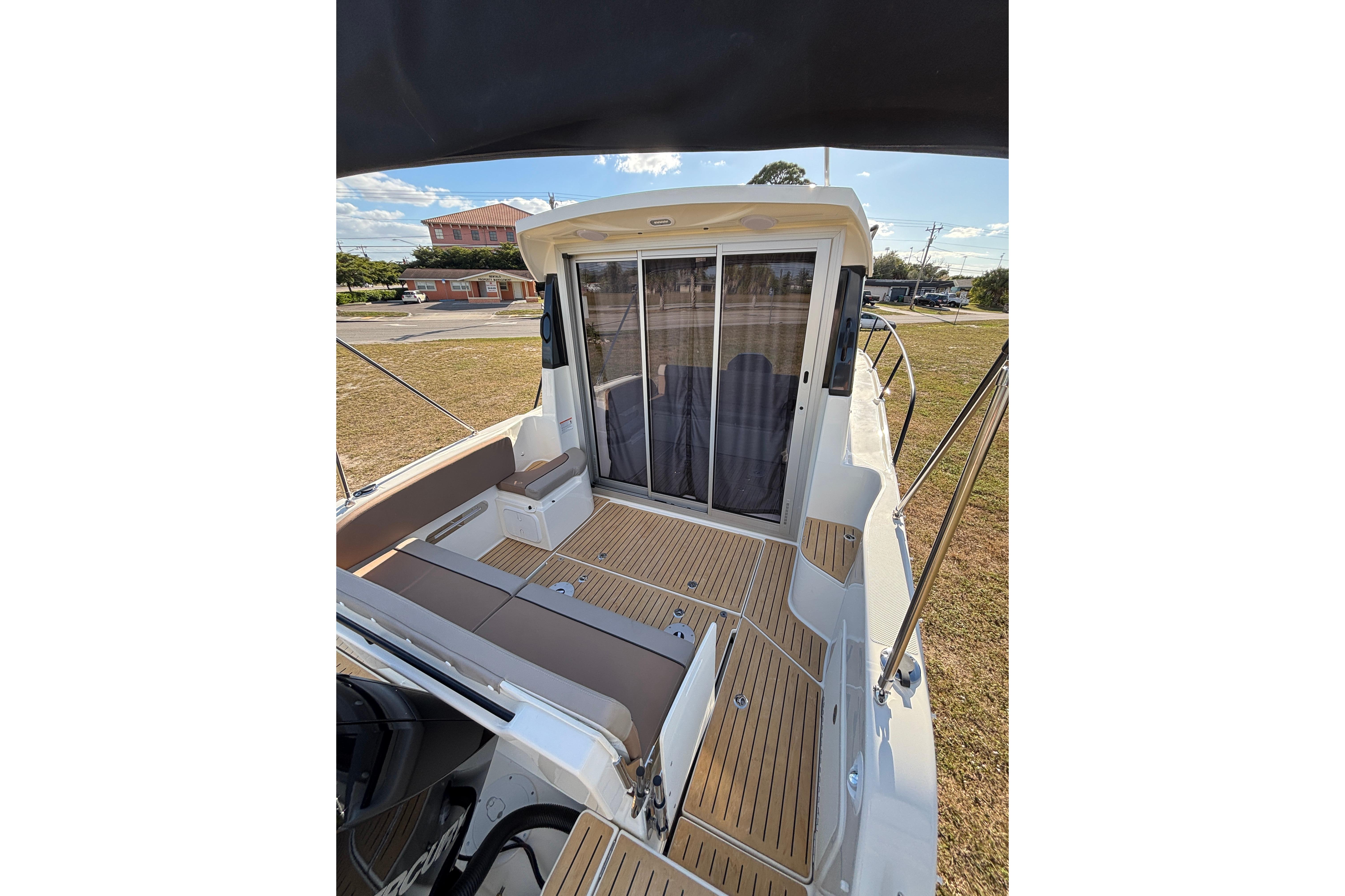 2026 Trophy T 25 Explorer boat deck with seating and sliding glass doors.