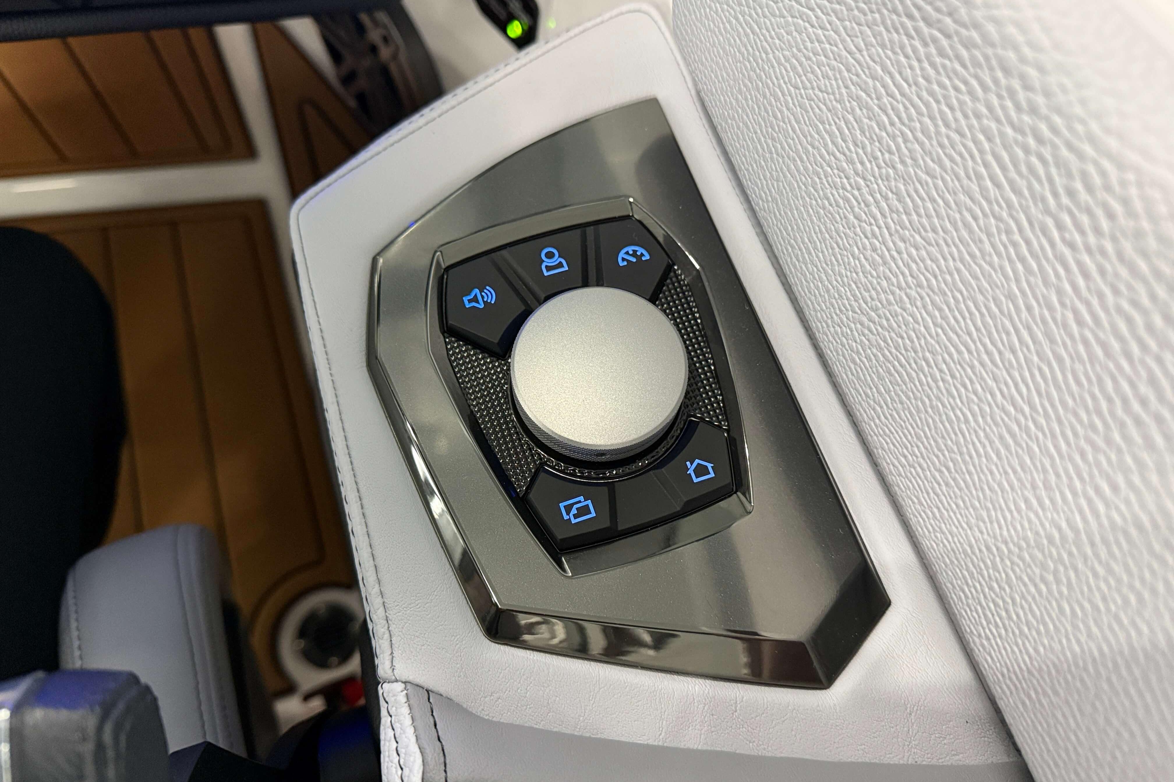 Control panel of 2026 Nautique Super Air Nautique GS22 boat with various function buttons.