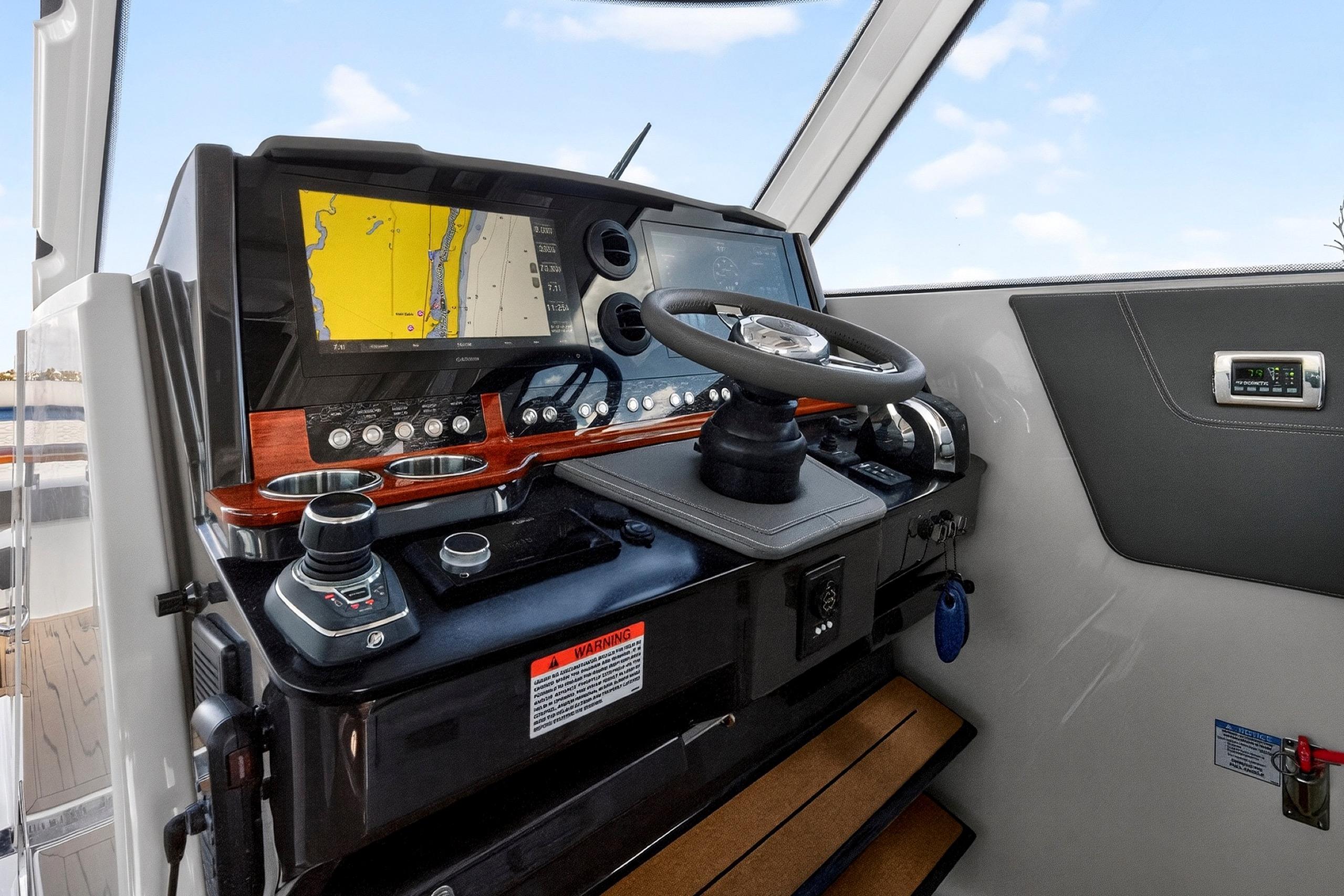 2022 Tiara Yachts 38 LX helm with navigation display and controls.