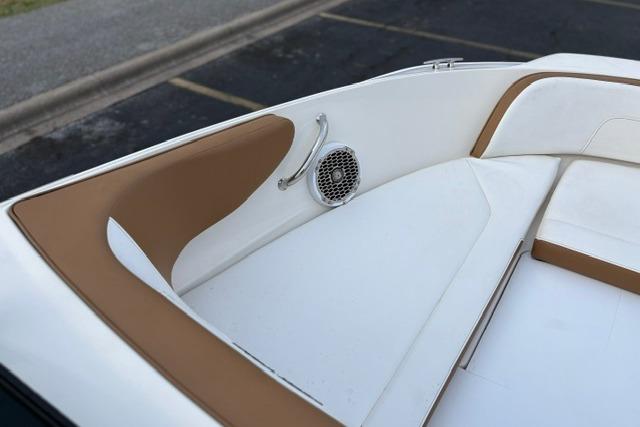 2017 Searay SPX210 boat interior with tan and white seating, featuring a speaker.