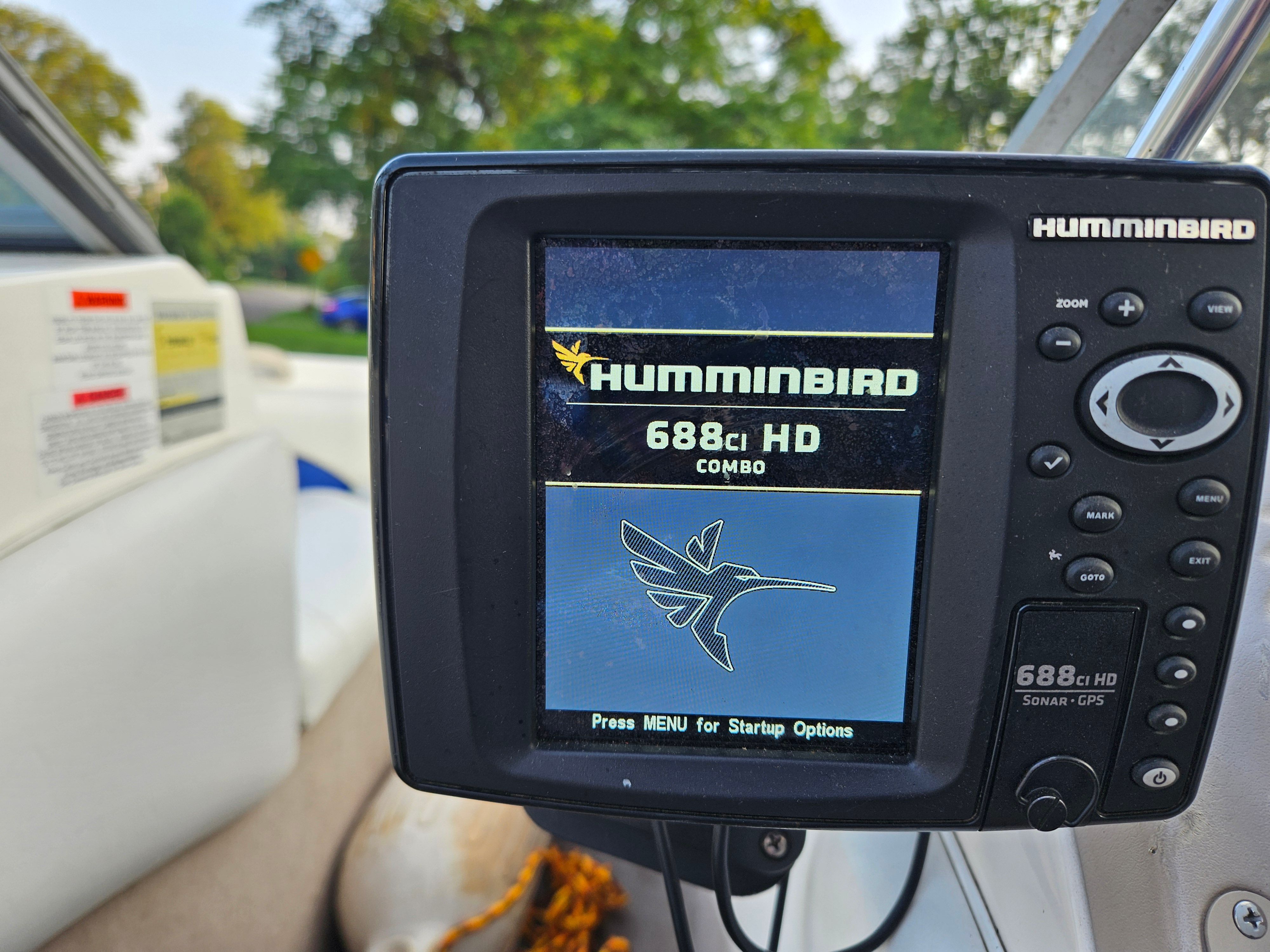 A Humminbird 688ci HD Combo fish finder is mounted on a boat.