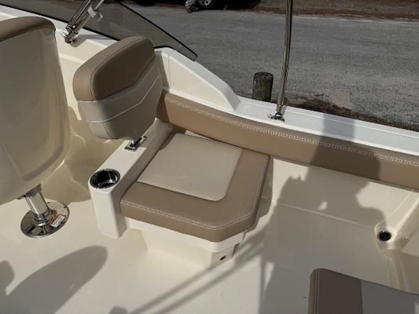 2025 Scout 215 Dorado boat interior with beige seating and cup holder.