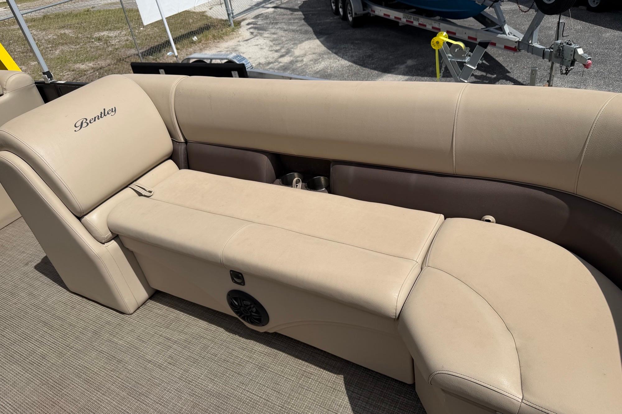 2022 Bentley Pontoons 240 CRUISE interior with beige seating and speaker detail.