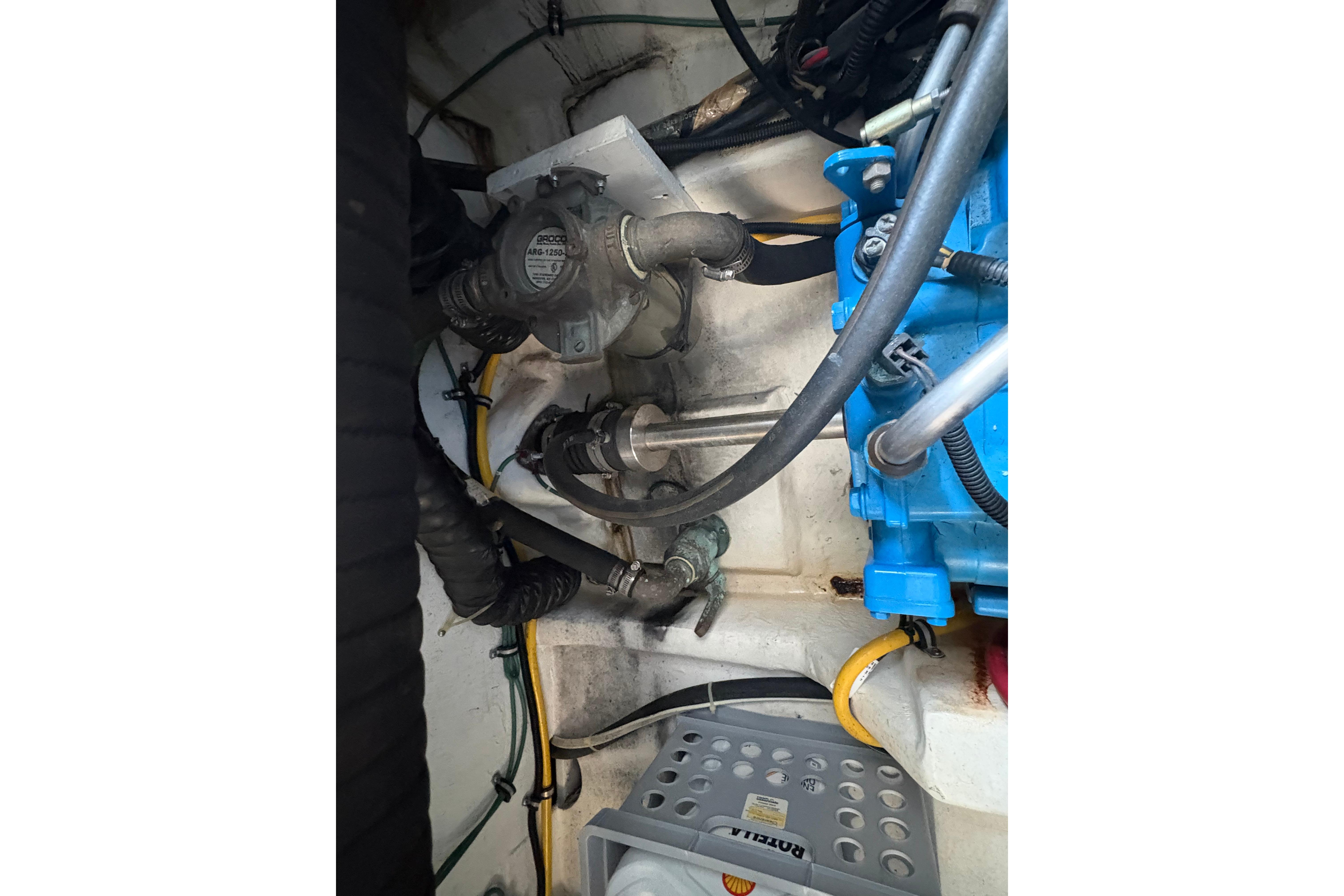 Engine compartment of a 1999 Tiara Yachts 3100 Open, showcasing mechanical components.