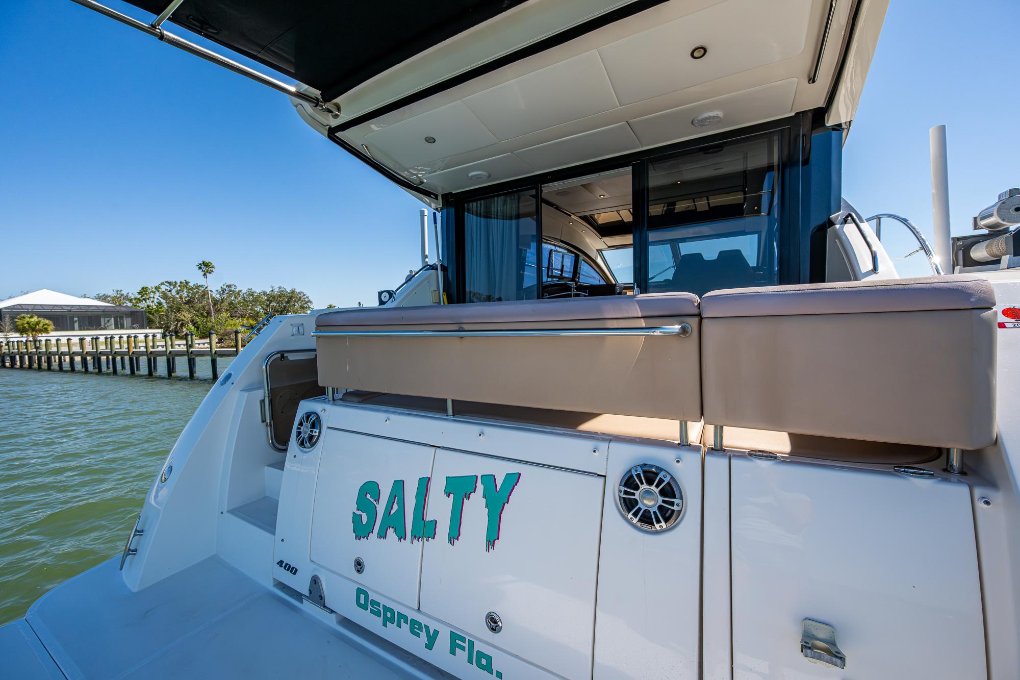 2017 Sea Ray Sundancer 400 yacht docked, featuring "Salty" name on the stern.