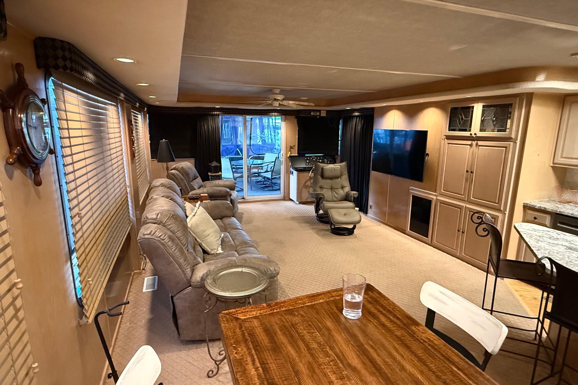 Luxurious 1998 Sumerset 16x76 houseboat interior with cozy seating and modern amenities.