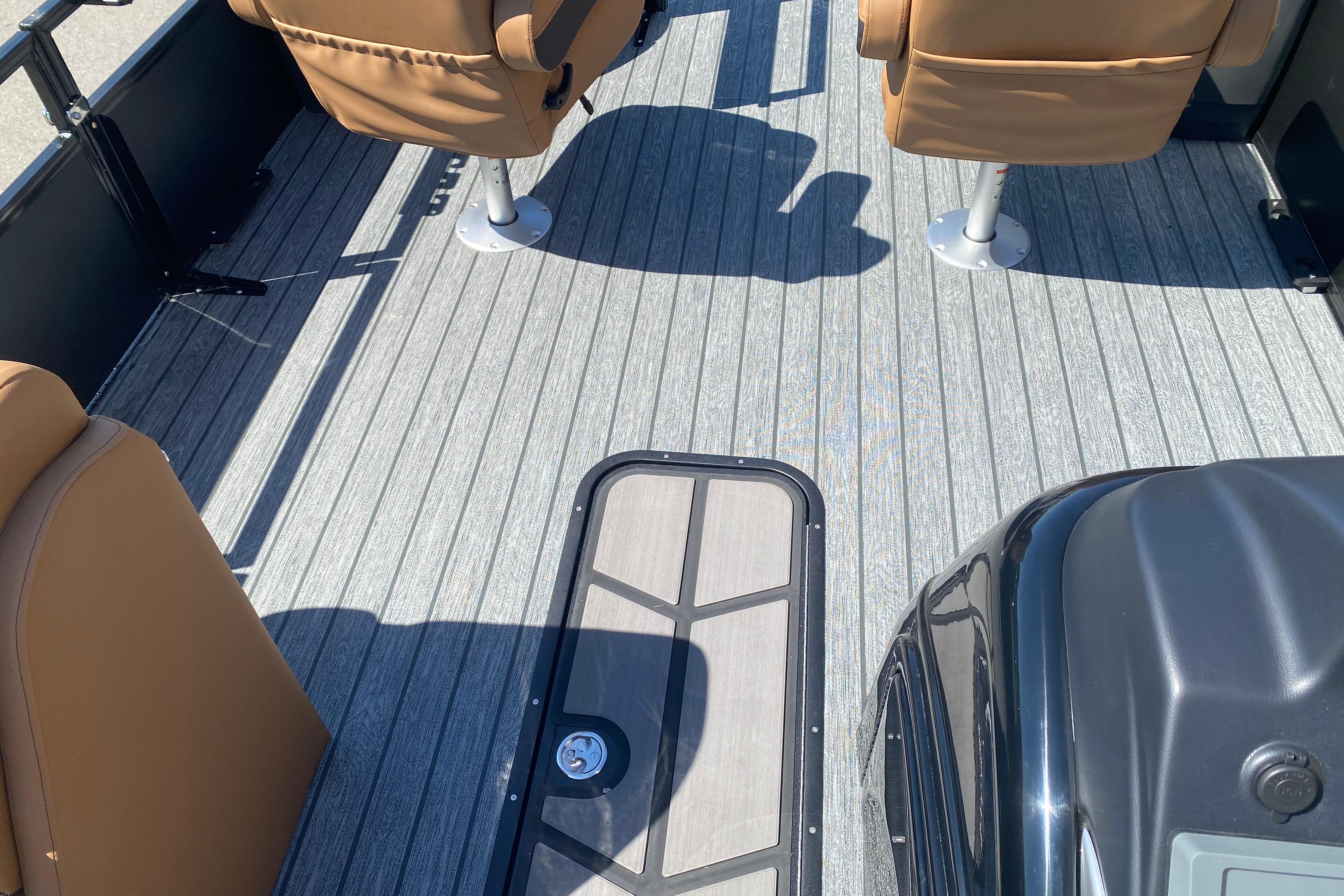 2026 Ranger 223F boat interior with tan seats and sleek flooring design.
