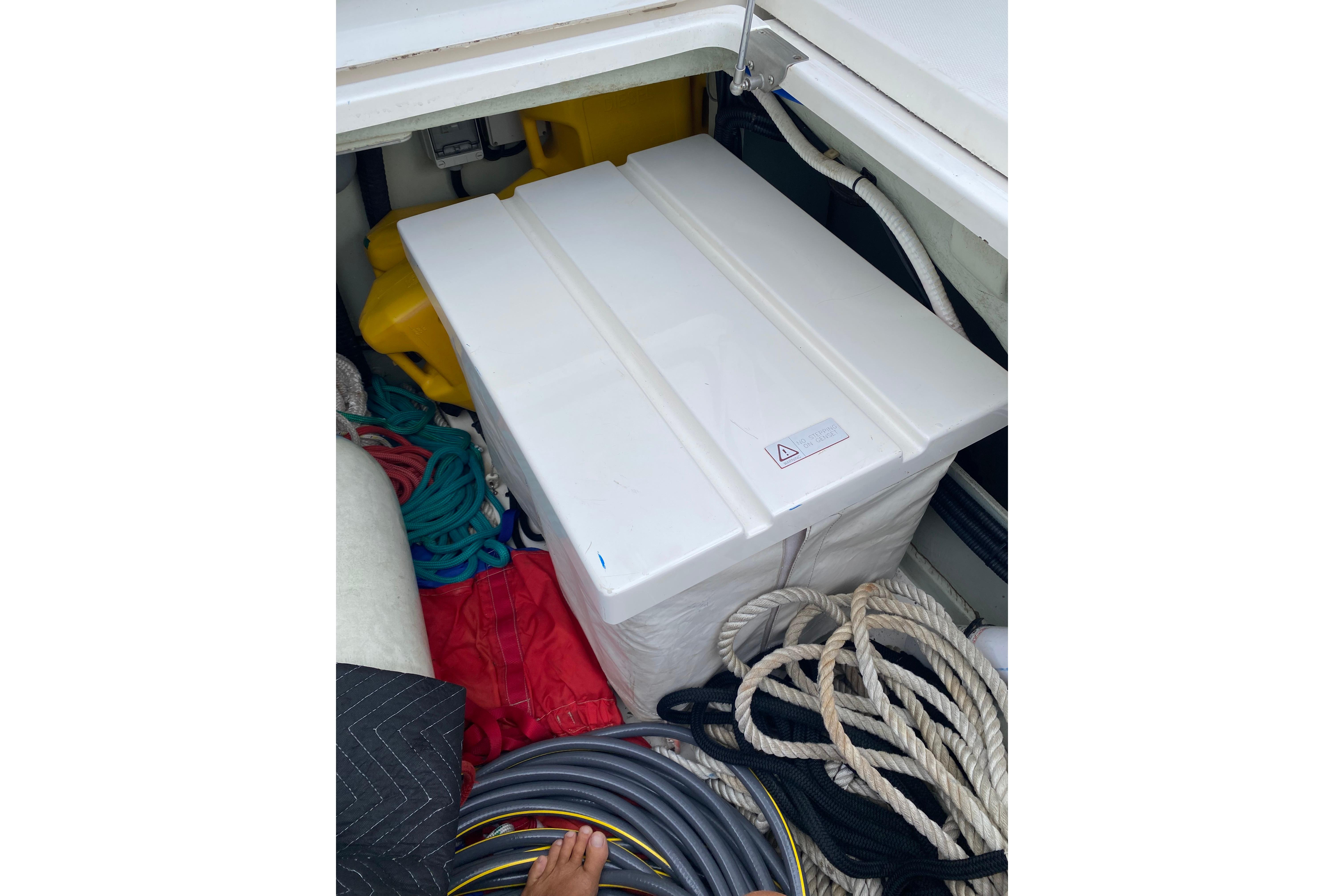 Storage compartment on a 2017 Leopard 40 boat with ropes and equipment.