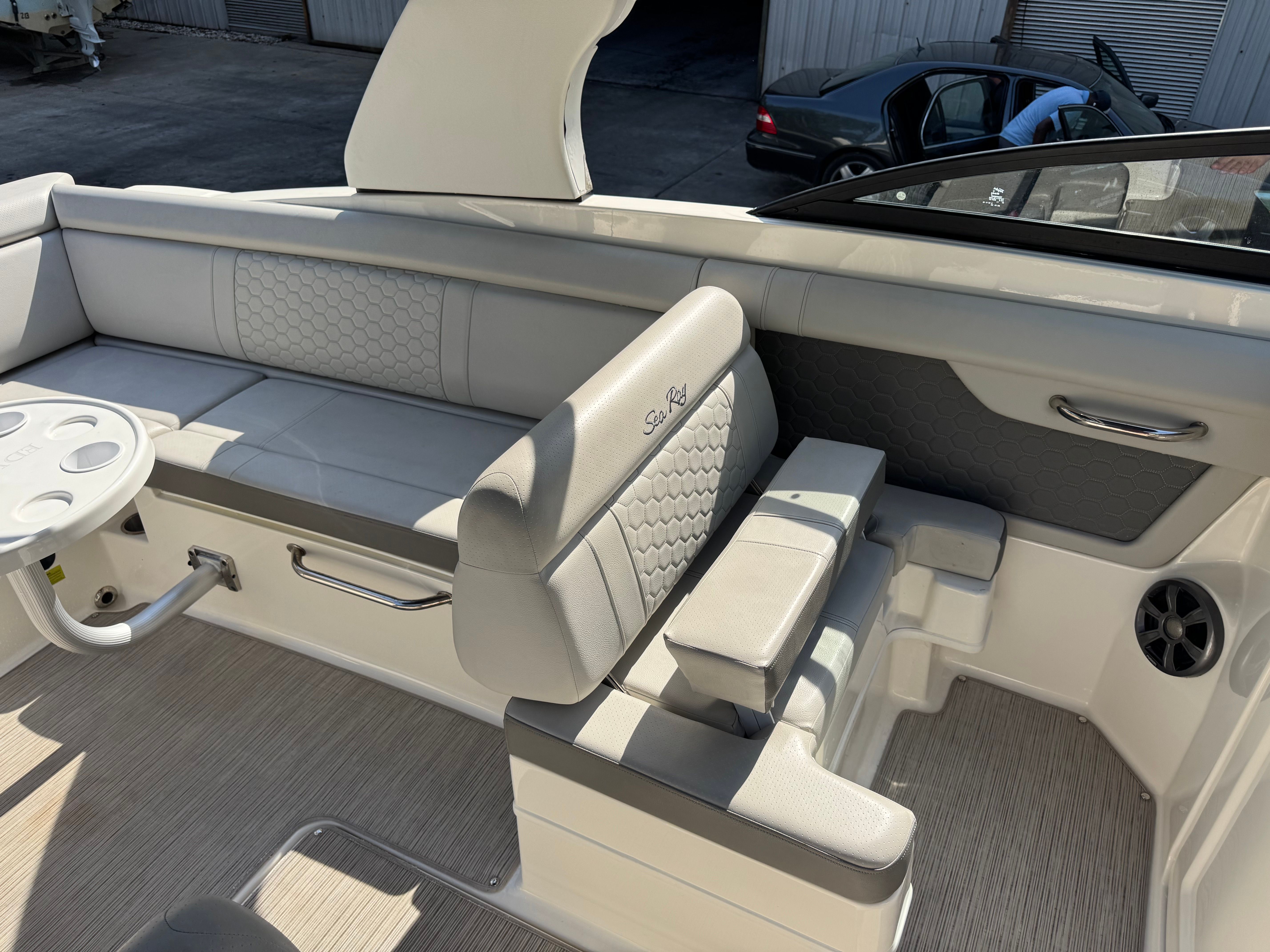 Interior of a 2020 Sea Ray SDX 270 Outboard boat with gray upholstery.