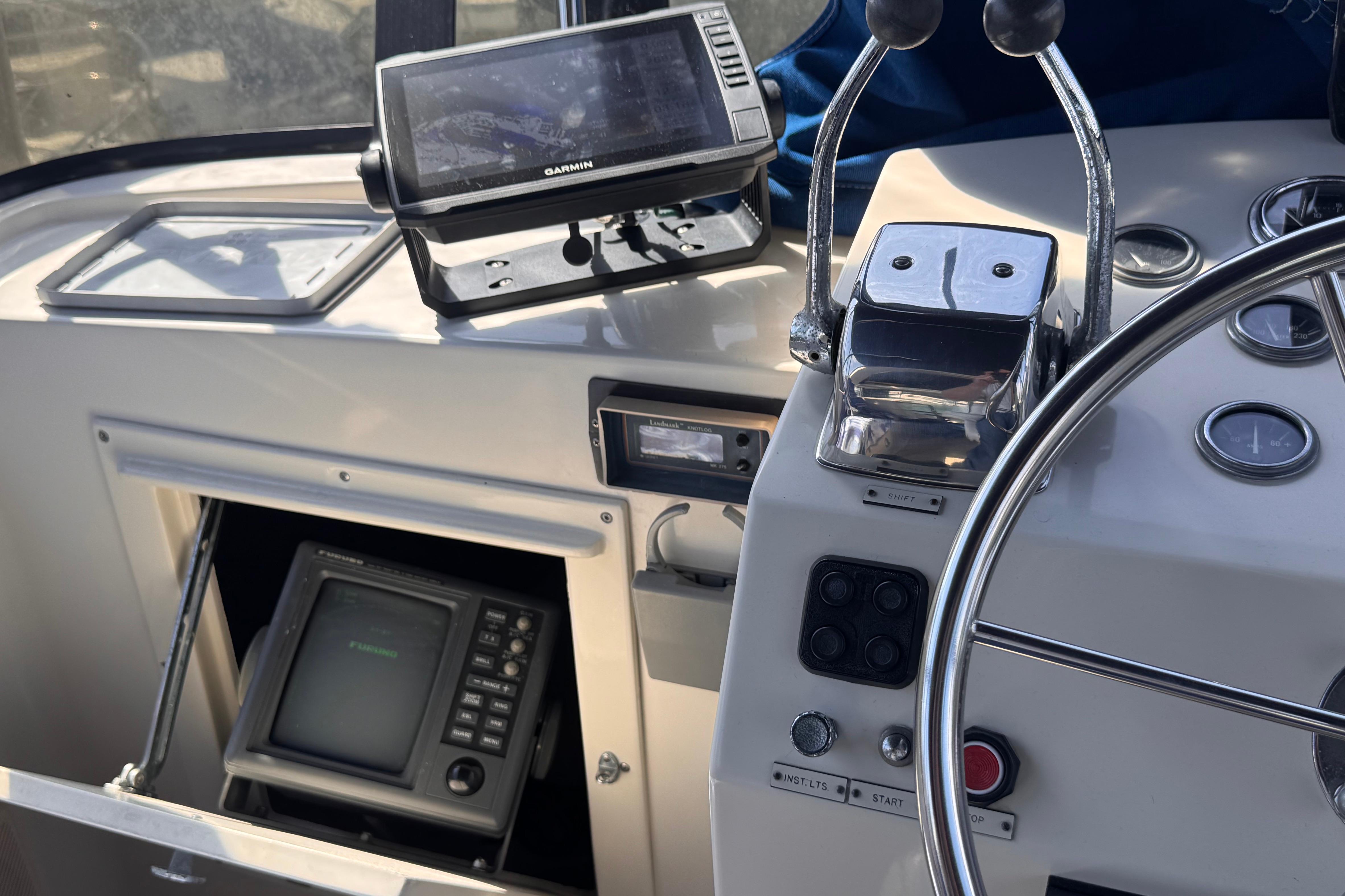 Control panel of a 1985 Californian 35 Motor Yacht with navigation equipment.