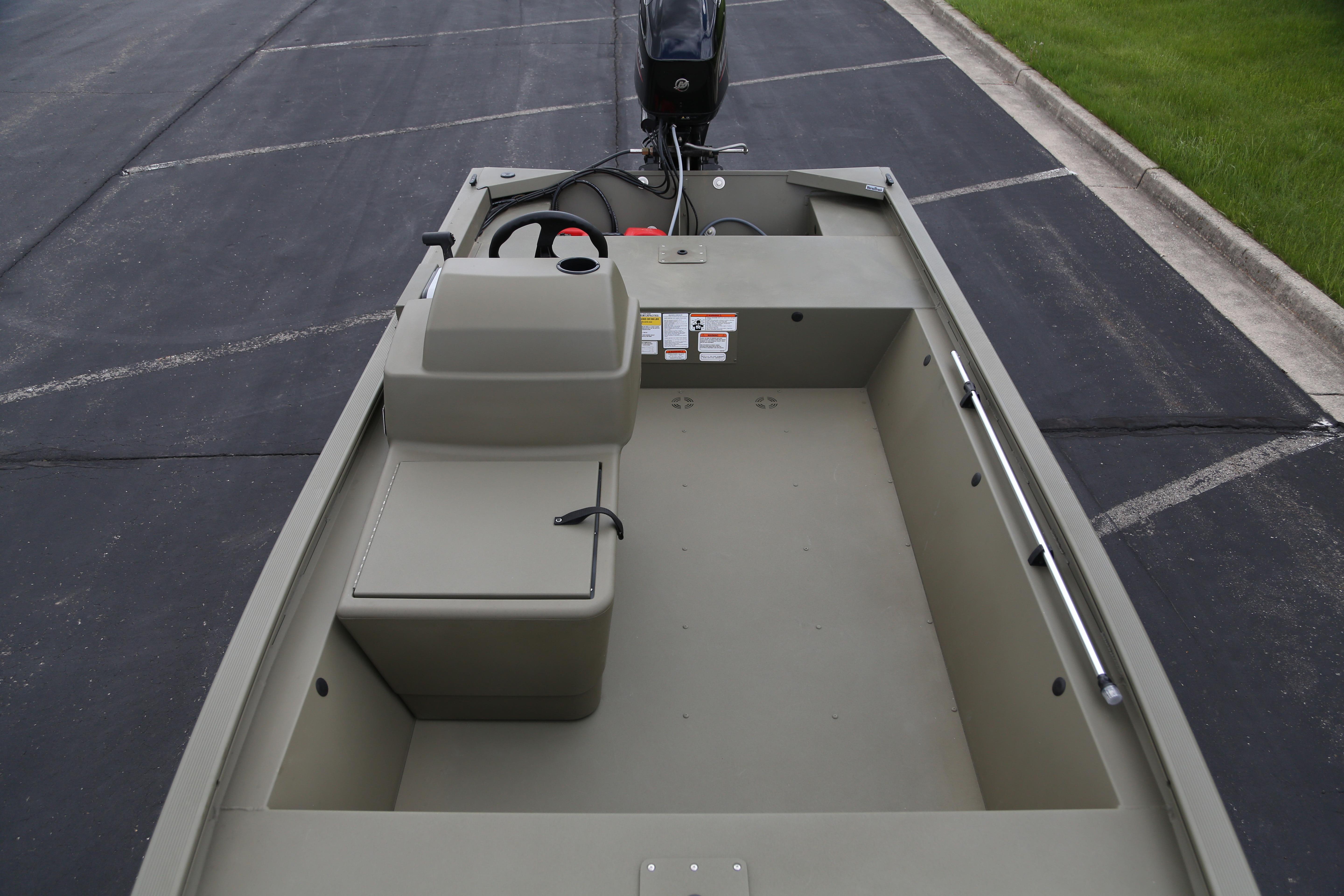 2026 Tracker Grizzly 1648 SC boat interior, featuring spacious seating and steering console.