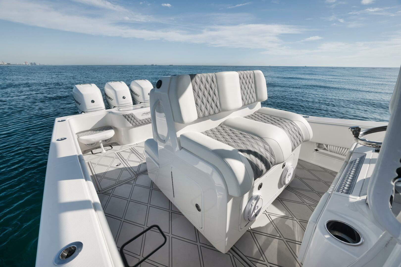 2020 Invincible Open Fisherman boat interior with cushioned seating and ocean view.
