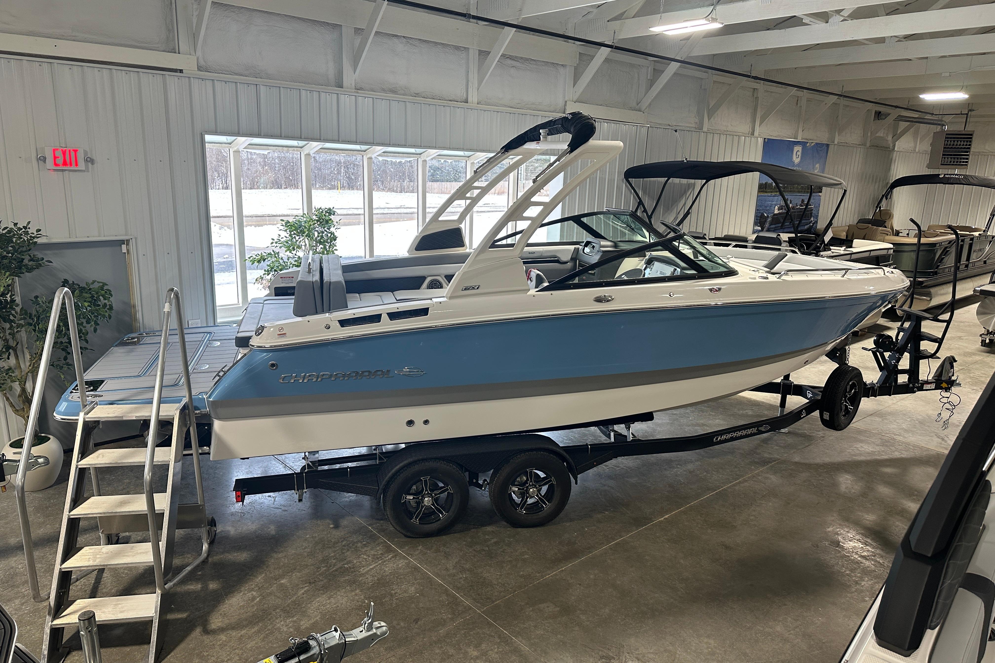 2026 Chaparral SSX 6 boat in a showroom.
