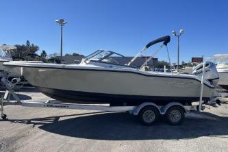 2022 Key West 239 DFS boat on trailer under clear blue sky.