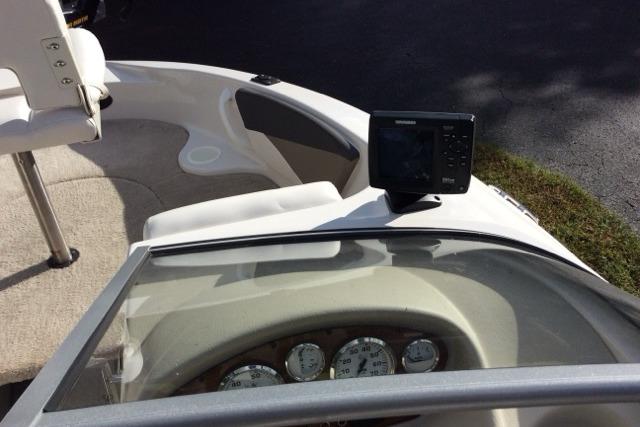 2012 Glastron GT180 boat dashboard with gauges and navigation system.