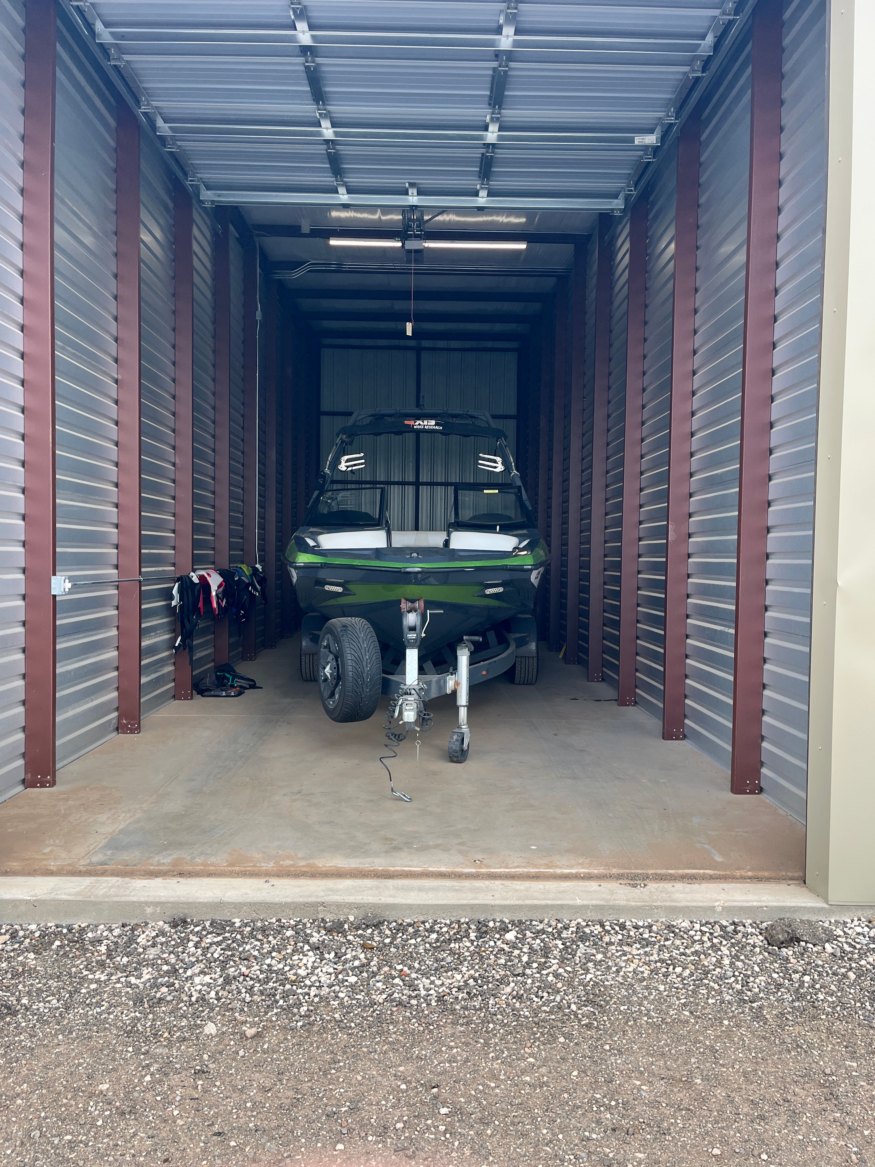2013 Axis A22 boat parked in storage unit.