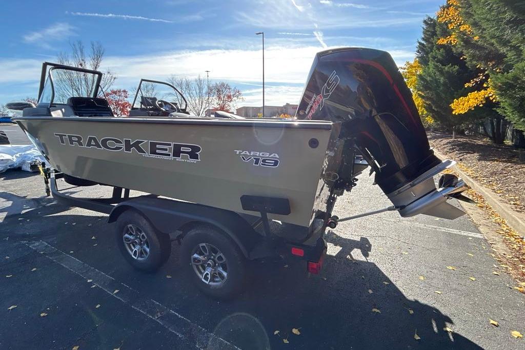 2026 Tracker Targa V-19 Combo boat on trailer, parked outdoors under clear sky.