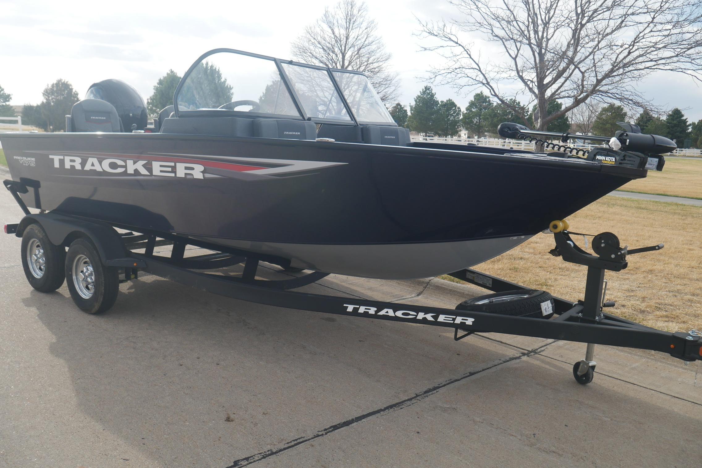 2026 Tracker Pro Guide V-175 Combo boat on trailer, parked outdoors.