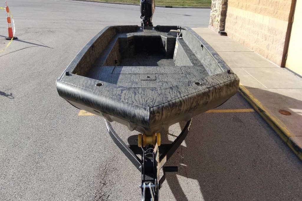 2026 Tracker Grizzly 1650 T Prairie Wings Edition boat on trailer, camo design.