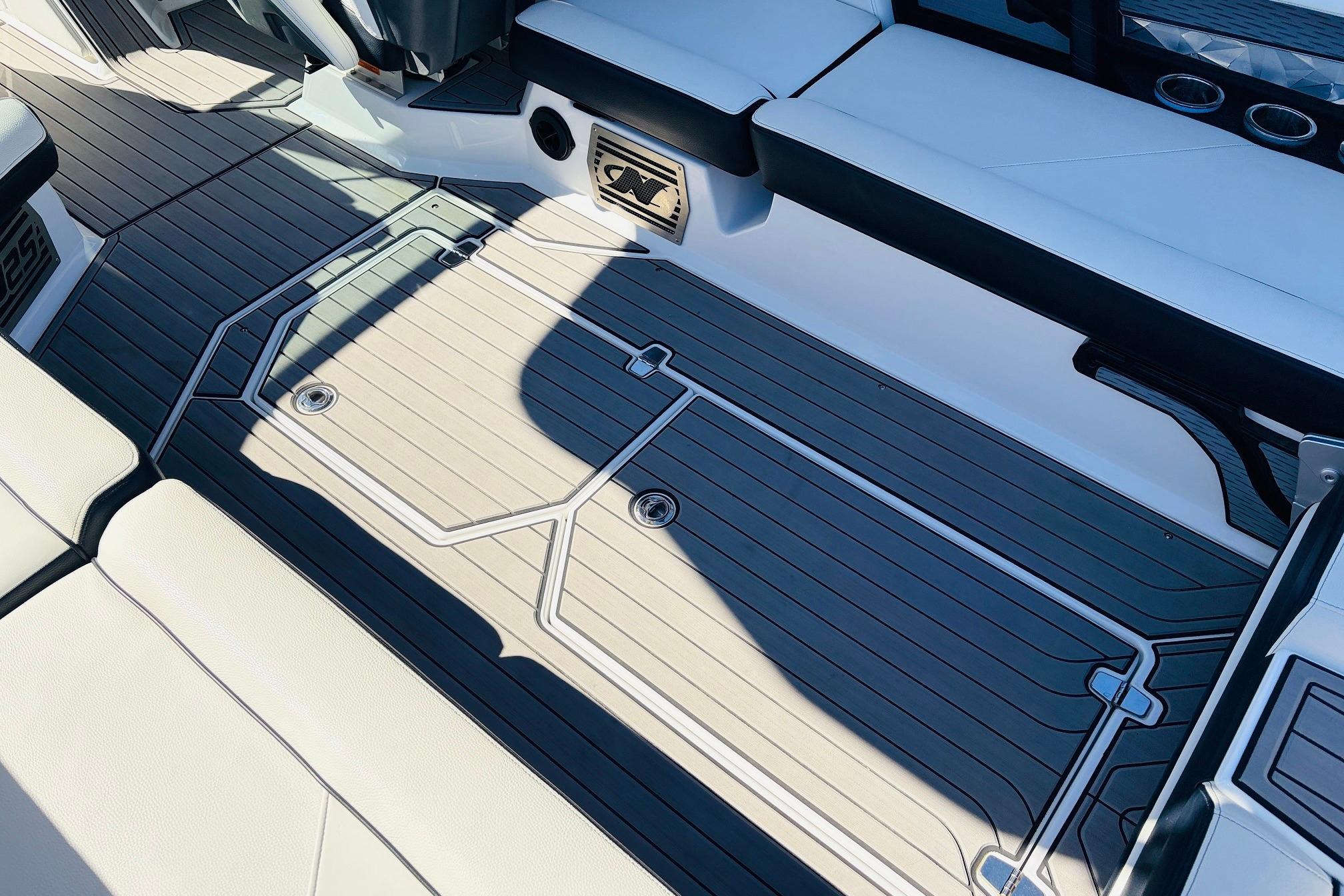 2023 Nautique Super Air Nautique G25 interior with sleek, modern seating and flooring design.