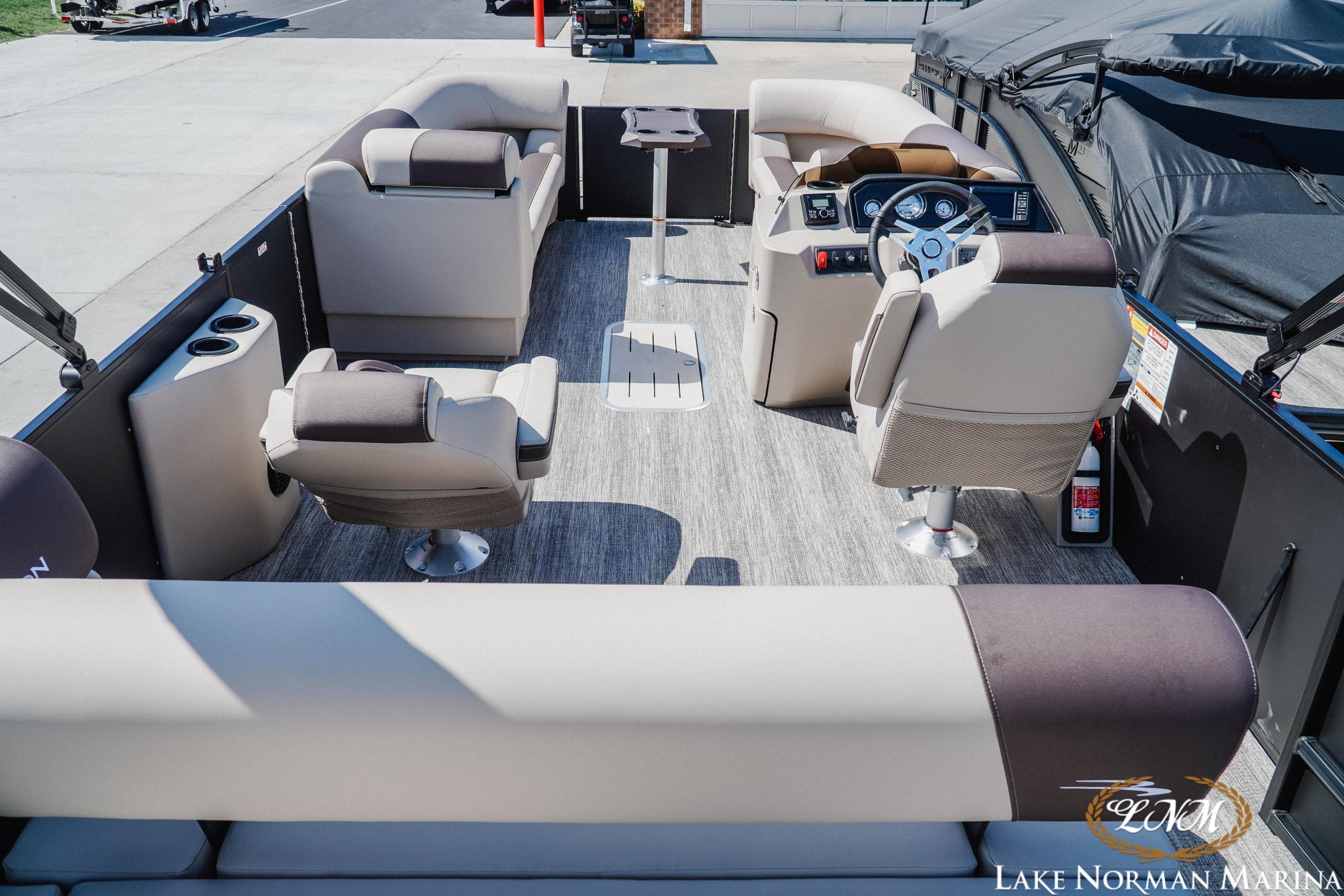Interior view of a 2027 Bennington 23ssb pontoon boat with luxurious seating and modern dashboard.
