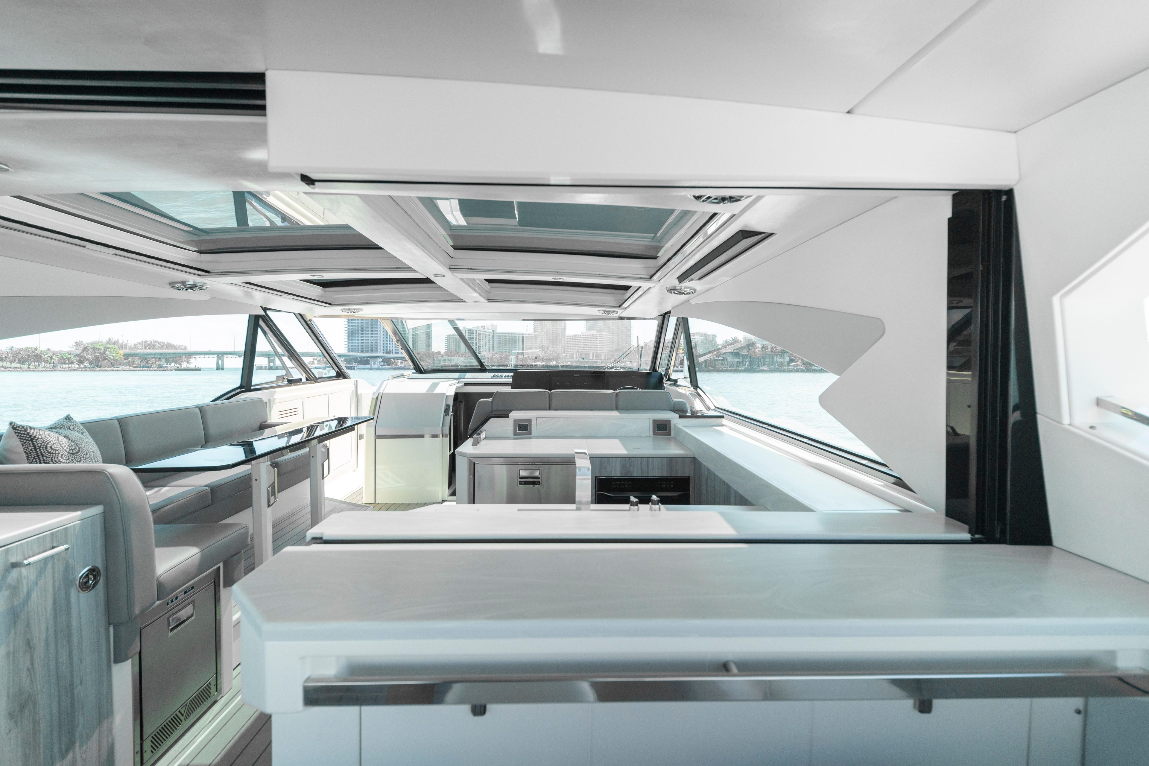 Luxurious interior of 2022 Formula 500 Super Sport Crossover yacht with modern design and panoramic windows.