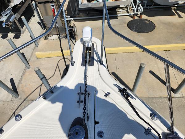 2005 Pursuit 3070 Offshore Center Console boat deck with anchor chain and railing.