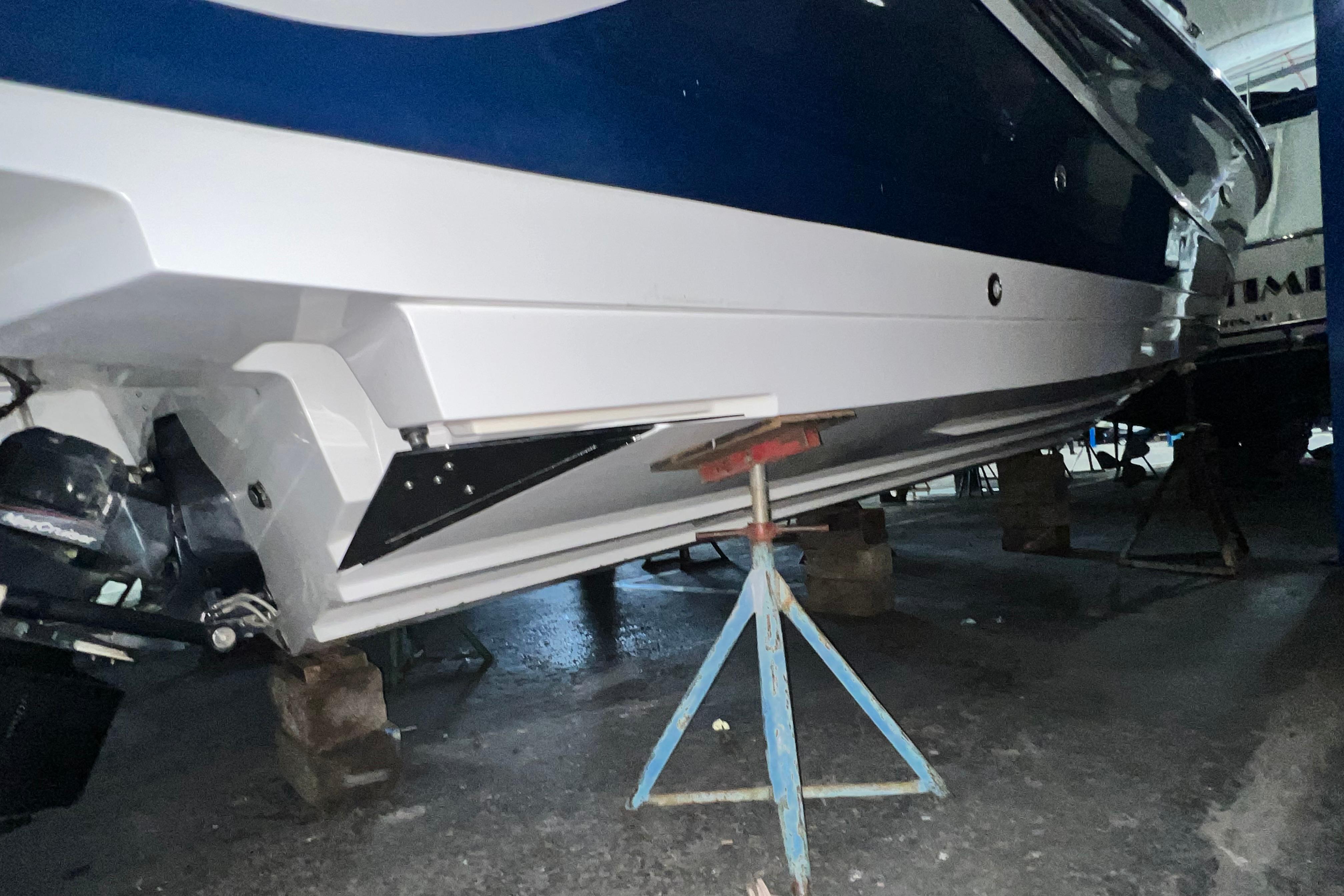 2017 Sea Ray SLX 280 boat on stands in a workshop.