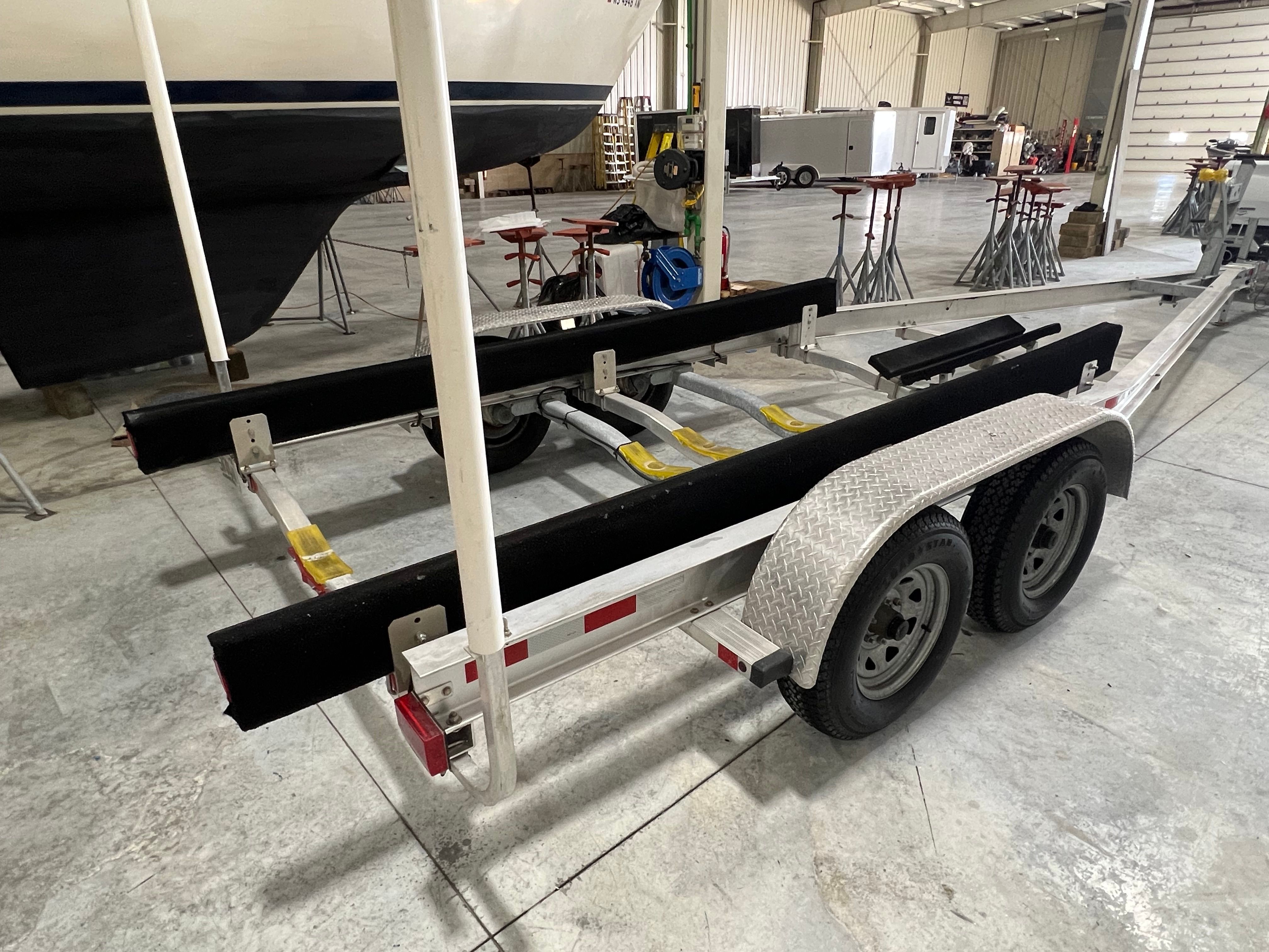 Boat trailer in a storage facility, ready for transporting a boat.