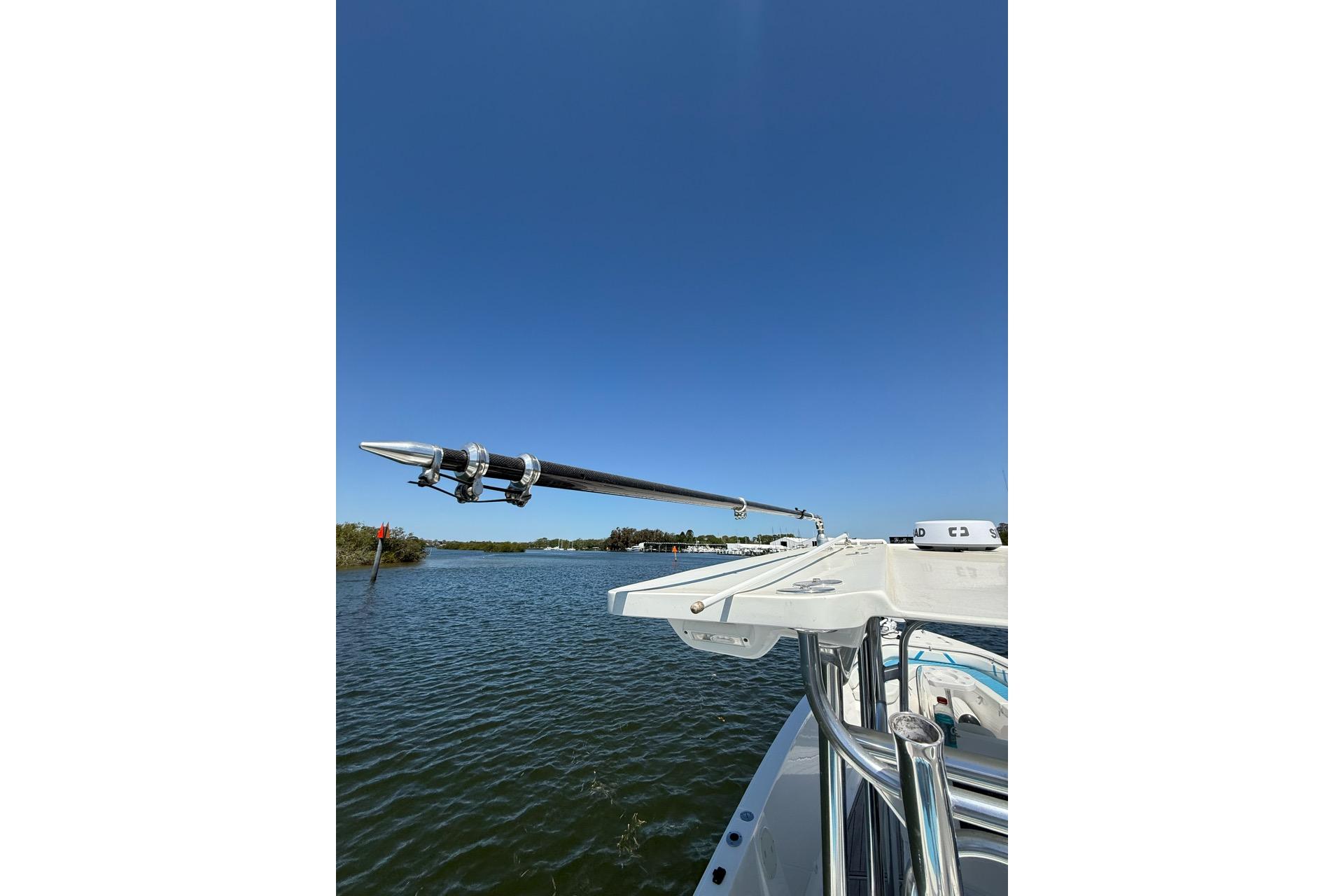 Custom Infusion 34 CC boat, 2021 model, on calm water under clear blue sky.