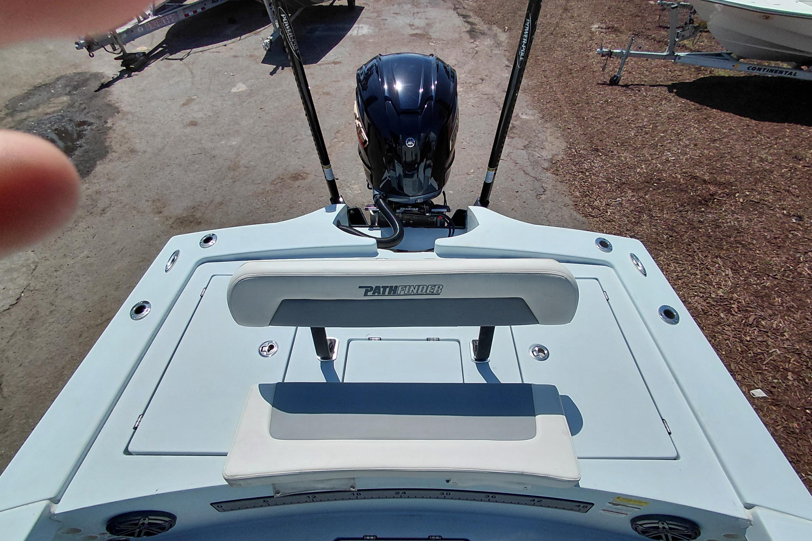 2022 Pathfinder 2300 HPS boat rear view with motor and seating.