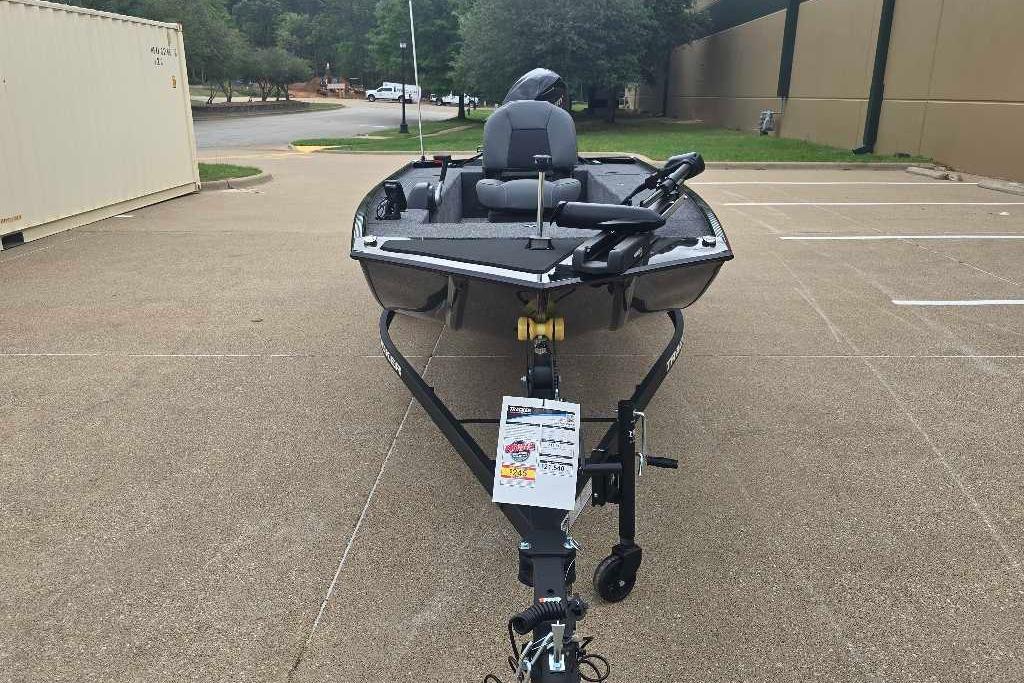 2026 Tracker Panfish 17 boat on trailer in parking lot.