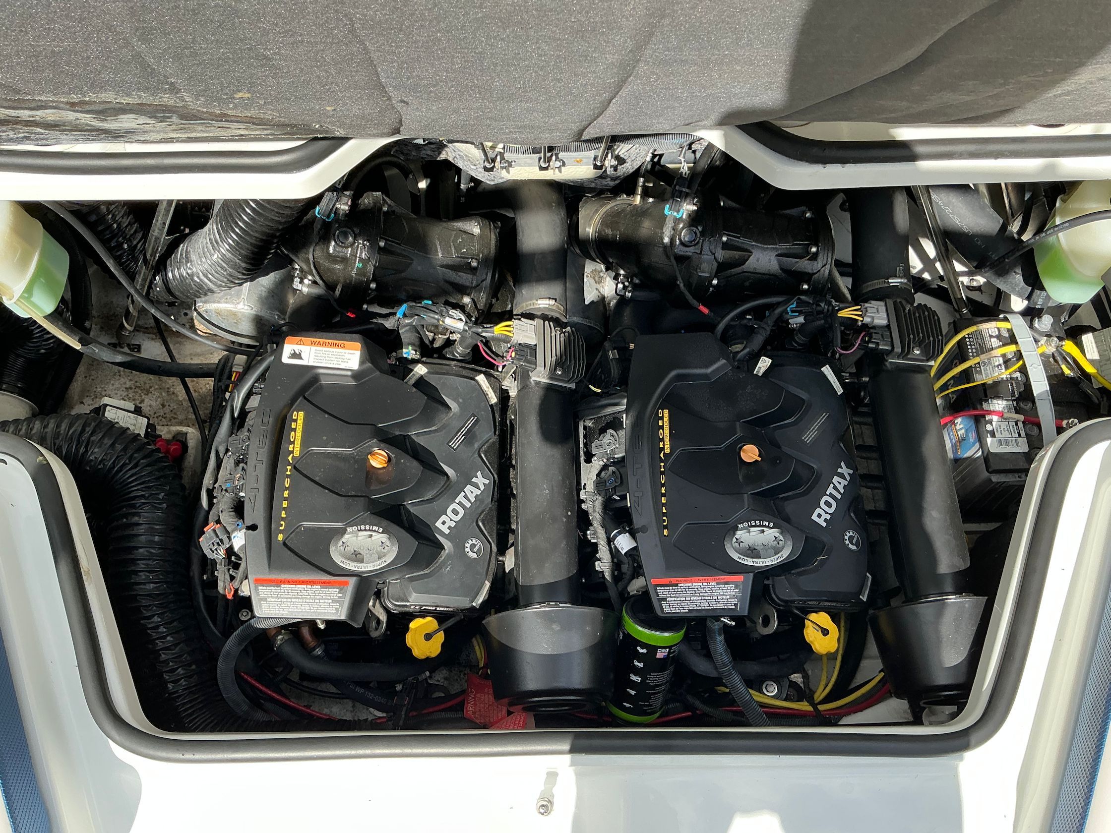 Engine compartment of 2021 Scarab 215 ID with Rotax engines.