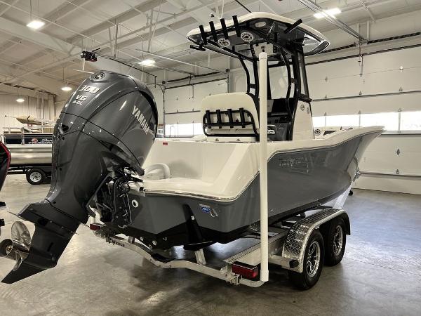 2023 Tidewater 232 CC Adventure boat in warehouse.