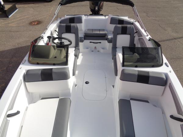 2024 Tahoe T21 boat interior with seating and steering wheel.