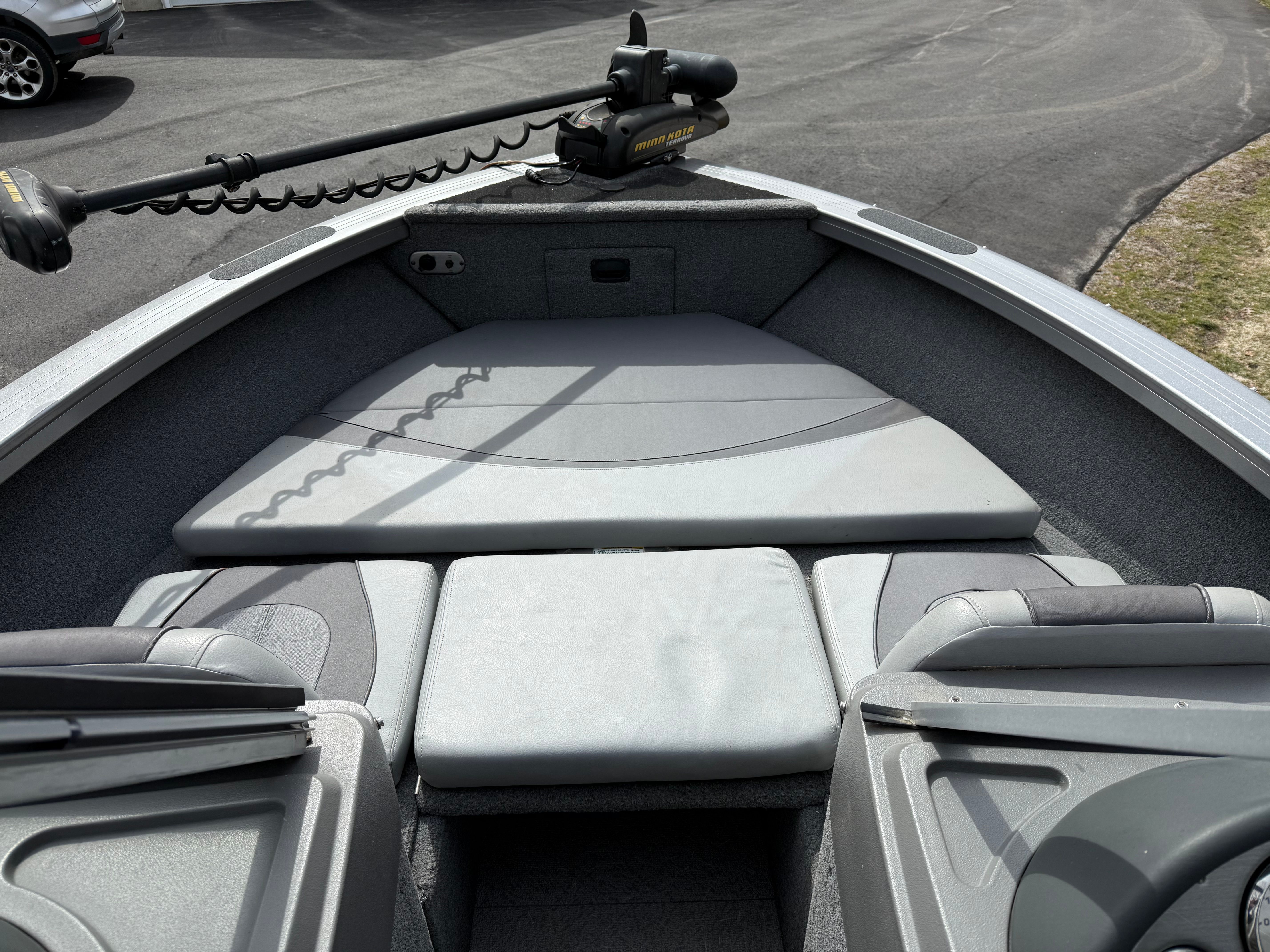 Interior view of a 2015 Crestliner 1850 boat with gray upholstery.