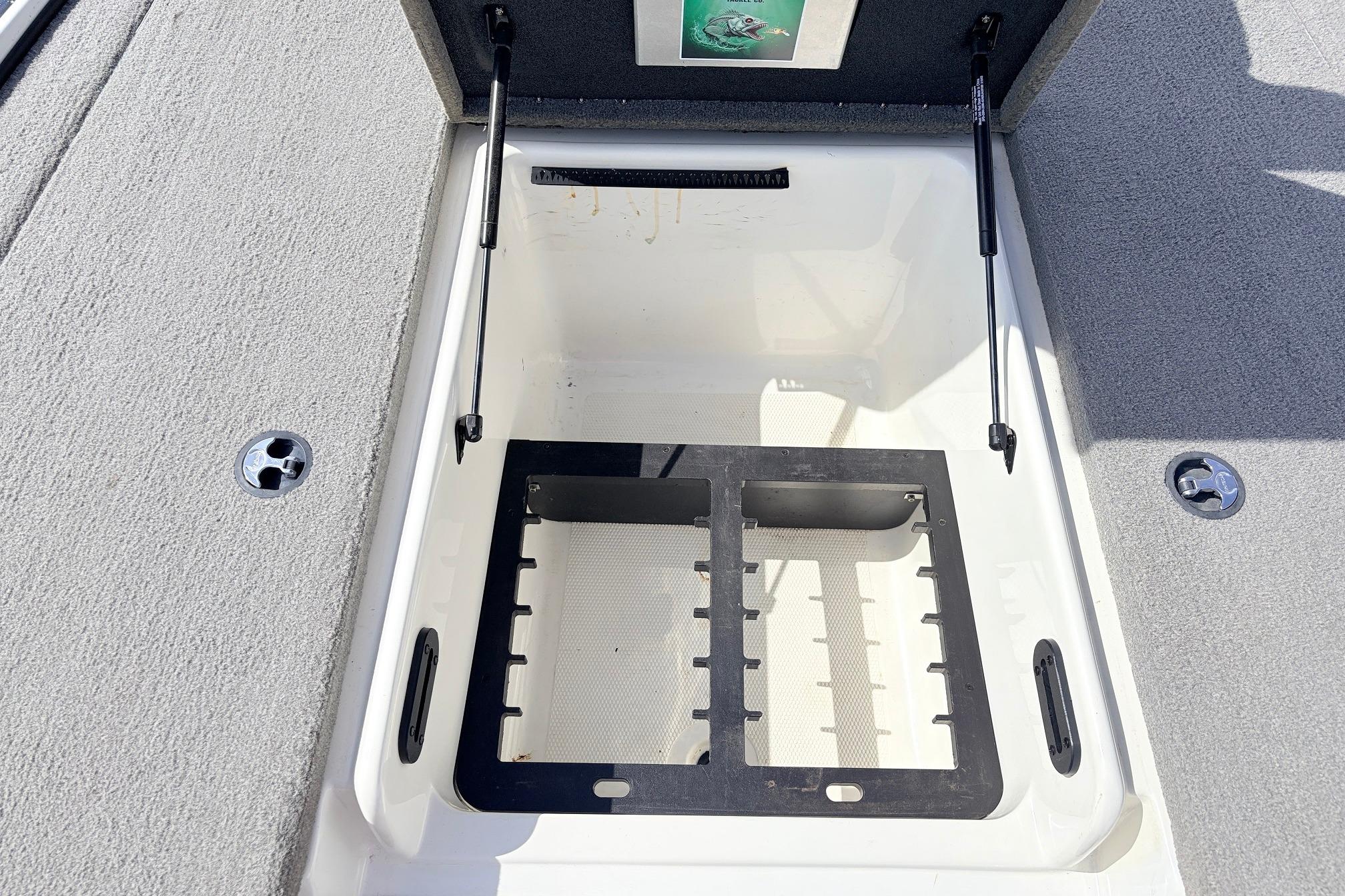 Open storage compartment in a 2011 Nitro Z-7 boat, featuring organized interior space.
