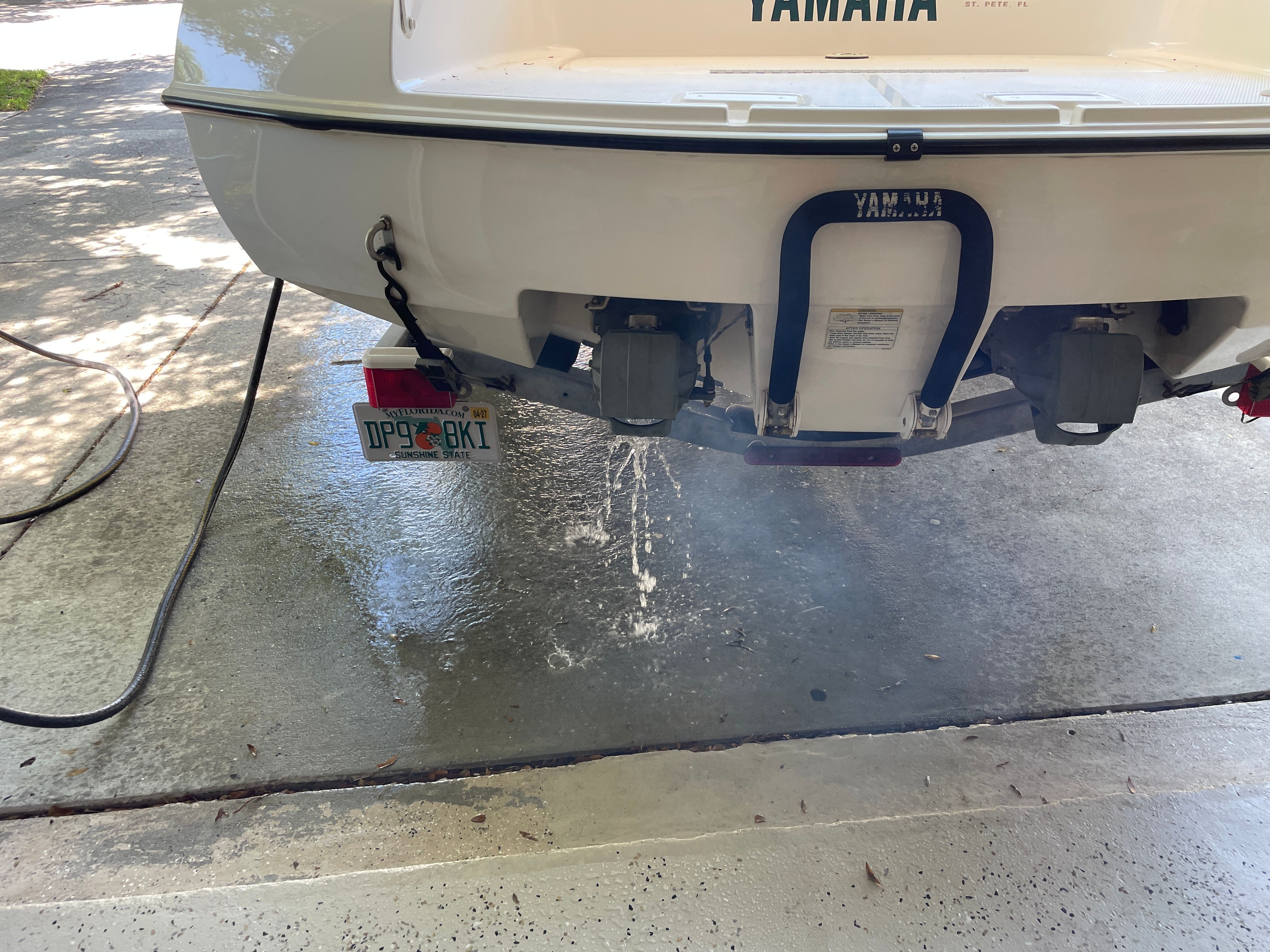 2000 Yamaha LS2000 boat with water draining on driveway.